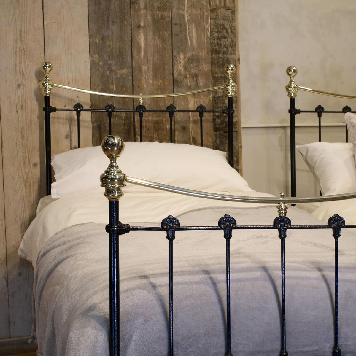 A matching pair of twin brass and iron beds finished in black with curved brass top rails.

These beds accept 3ft wide (36 inch or 90 cm) bases and mattresses.

The length can be 75 inches, 78 inches or more if required.

These beds can be