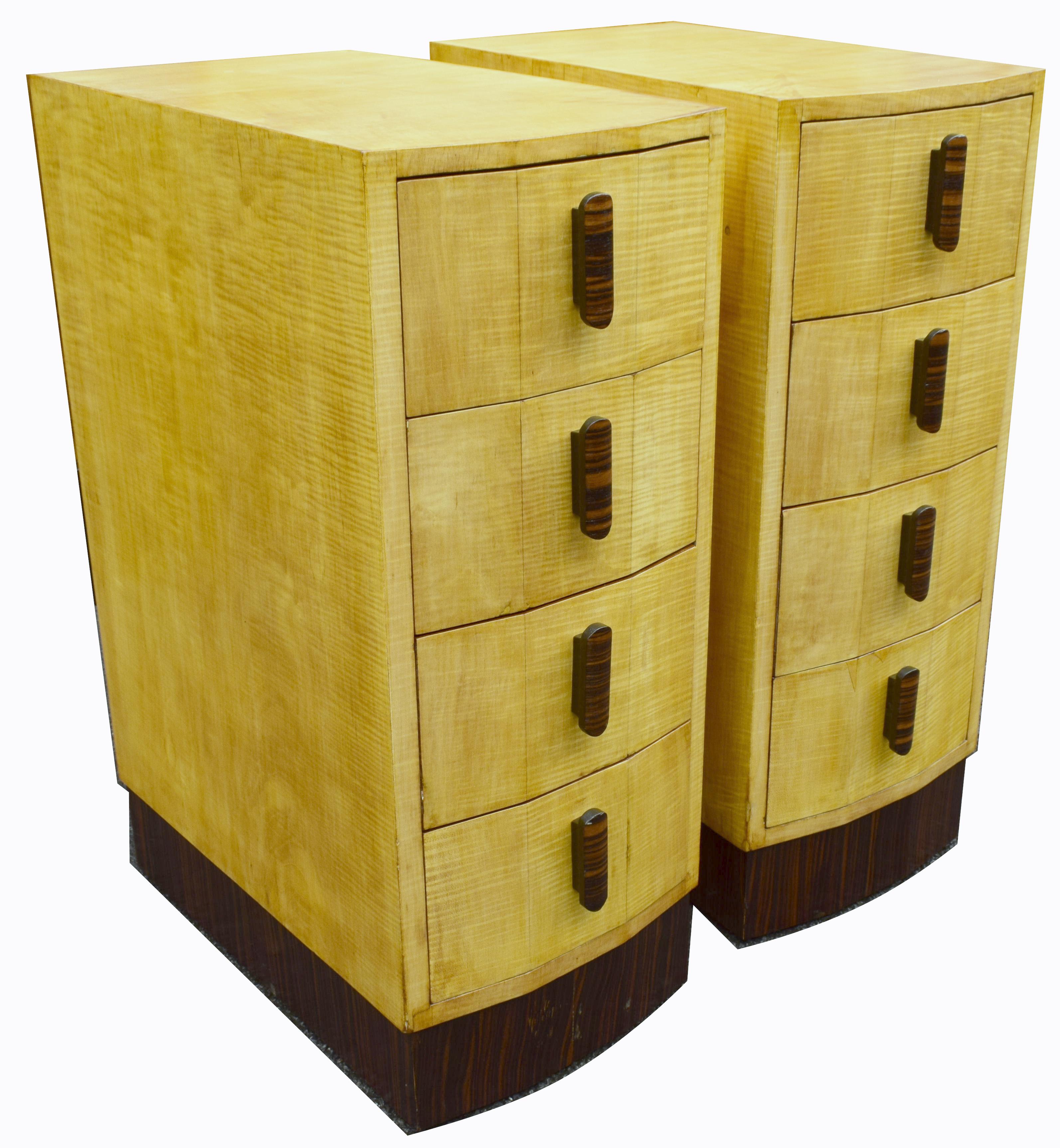 Superbly stylish 1930s Art Deco matching pair of bedside cabinet tables. Rare bleached blonde sycamore veneers with a beautiful Macassar handles. You can sense the quality in these cabinets immediately, from the timbers used to the fine detailing of