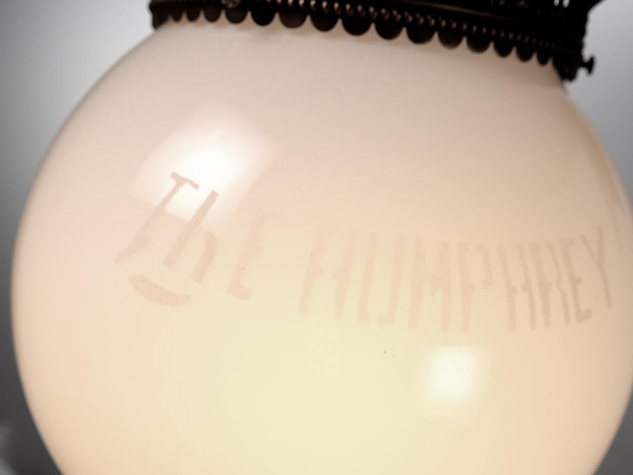 I can’t believe we have a matching pair of these amazing and ornate Humphrey lamps. Both milk glass globes are signed THE HUMPHREY. The lamps have been restored refinished and rewired. They are now each illuminated by an E12 candelabra bulb. Note