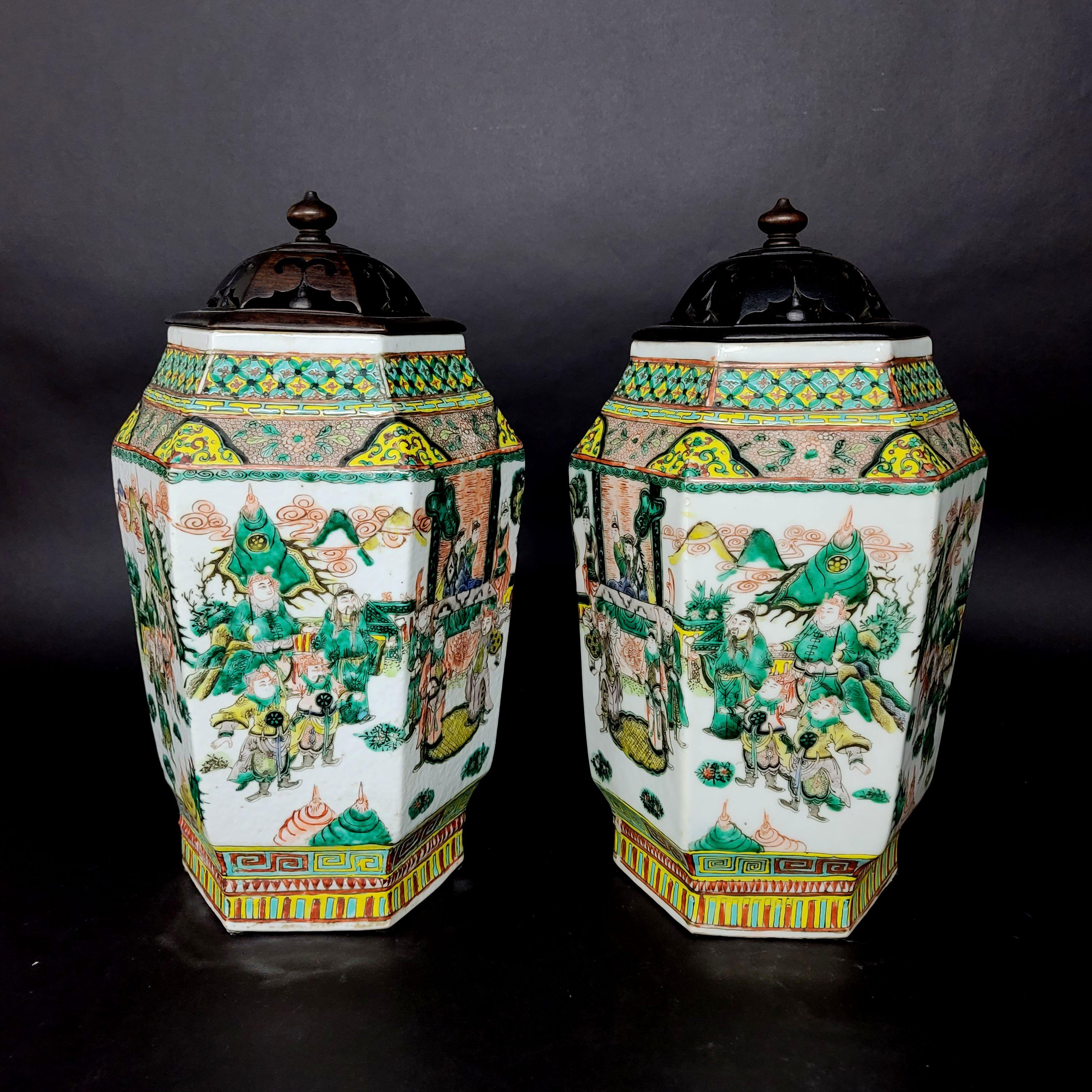 A truly fine hand-painted matching images of porcelain vases, amazing quality from Qing Dynasty Famille rose polychrome decorated panels of courtly pursuits with carved hardwood lids.

 