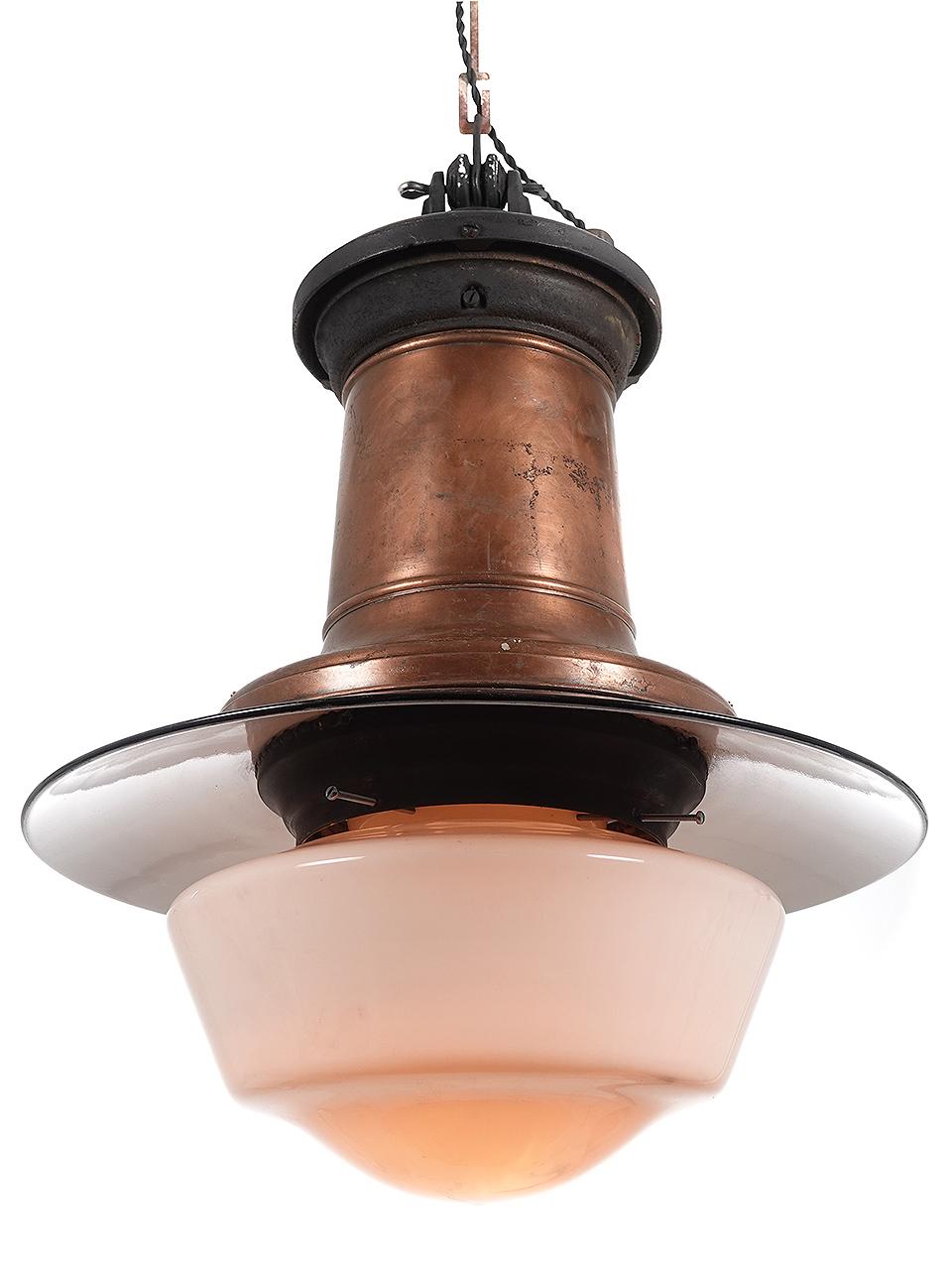 This is an early street lamp rewired and finished for home use. The look is striking in all copper and black. It has a 20 inch diameter porcelain black over white shallow domed shade over a large schoolhouse style milk glass globe. The lamp is 26