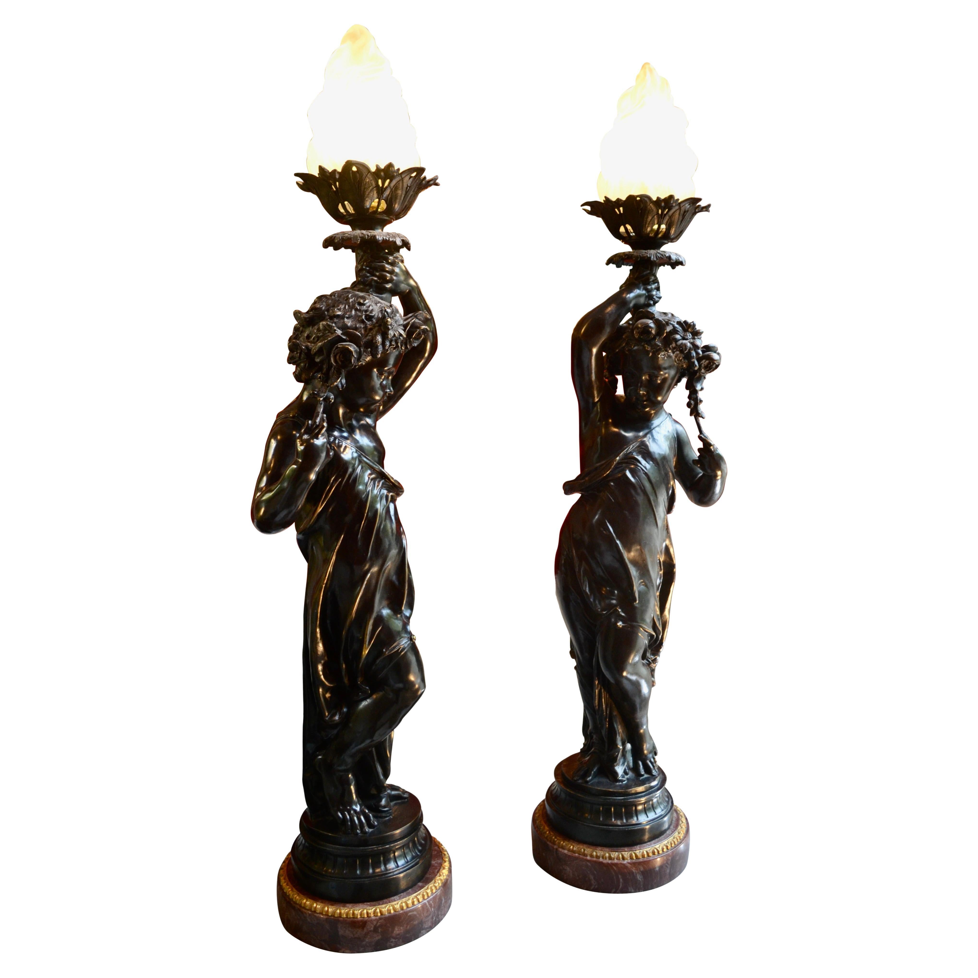 Matching Pair of Figural Patinated Bronze Flame Torcheres after Clodion For Sale