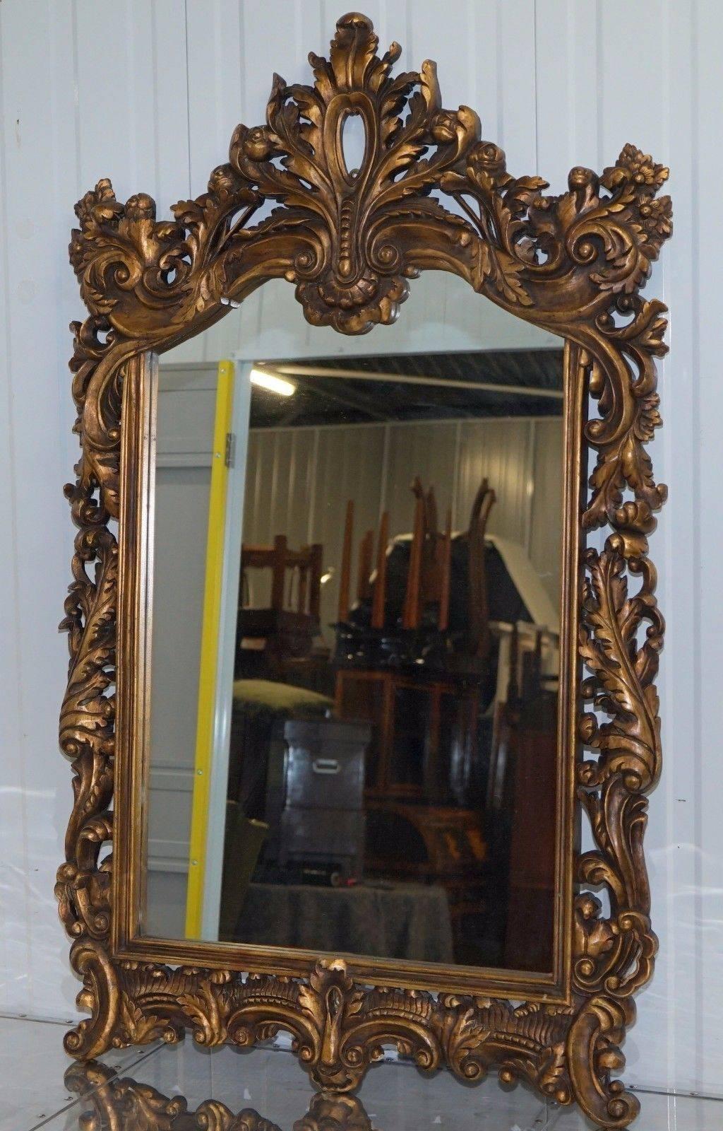 We are delighted to offer for sale this very nice pair of vintage hand-carved wood French rococo style ornate wall mirrors with gold leaf paint

A very good looking and highly decorative pair in excellent condition, one mirror is missing a little