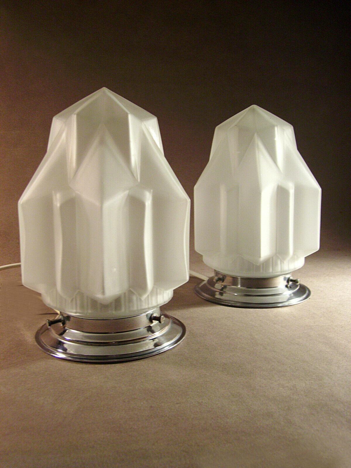 Very striking matching pair of Art Deco ceiling lights which also double as table lamps. Lovely skyscraper glass shades in sandblasted frosted glass with a geometrical shape (opening at the neck 8 cm). These lights although originally intended as
