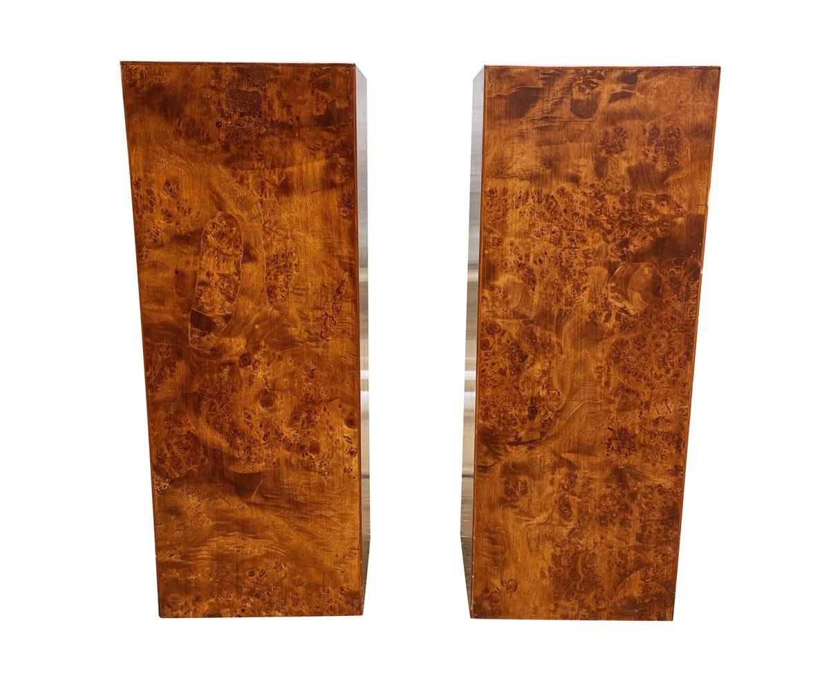A handsome pair of burl wood matching pedestals from Italy circa 1960's. These consist of beautiful mixed wood burl design. Fine pieces marked made it Italy. These are priced each and a pair is currently available as shown.