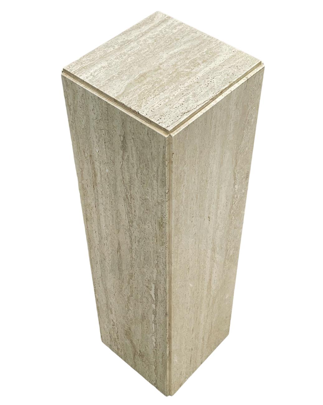 A simple modern pair of pedestals from Italy, circa 1980's. These consist of solid travertine slabs. Very heavy and beautiful pieces. Price includes the pair.