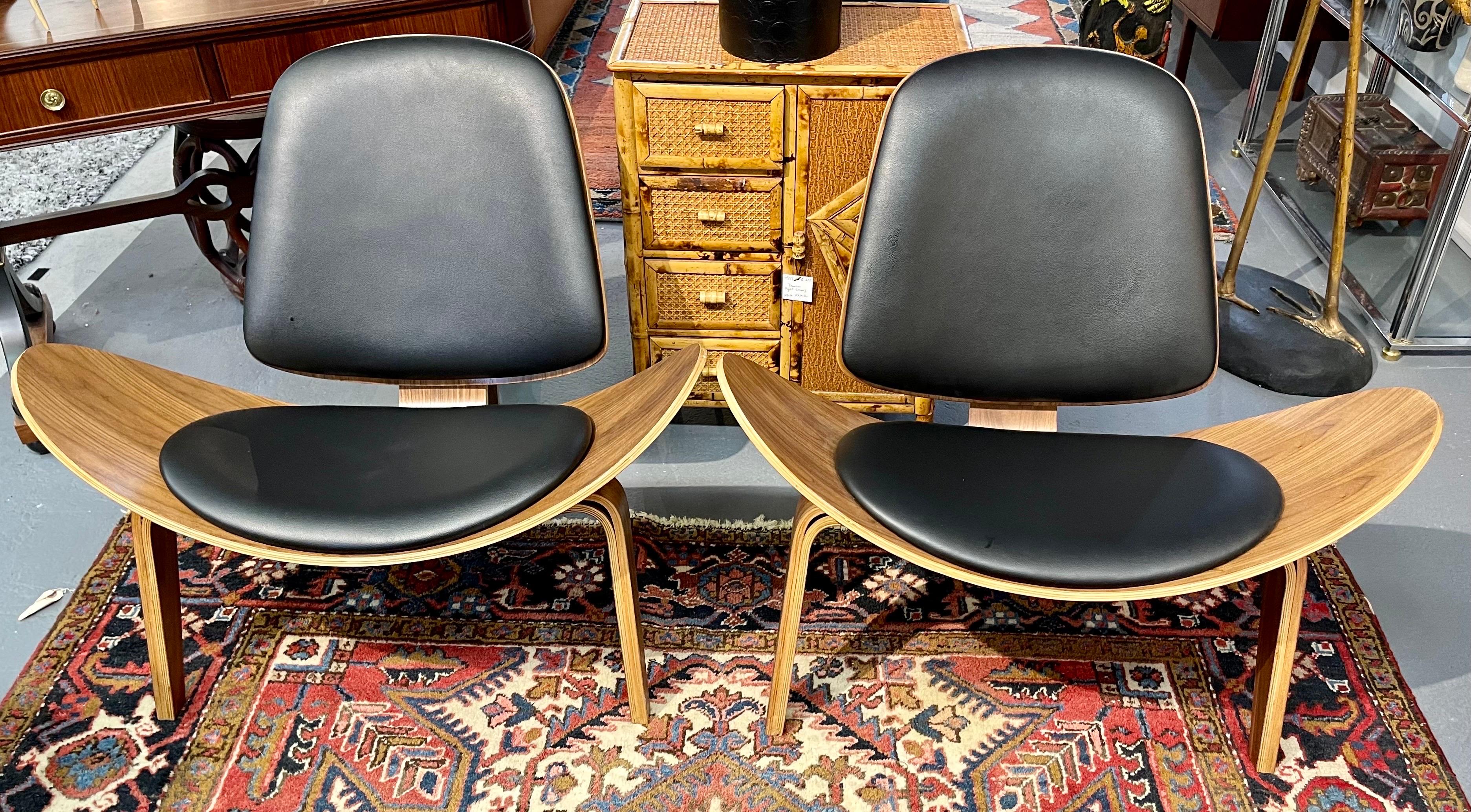 Stellar pair of matching mid century style scoop lounge chairs. They sit very comfortably and have great scale and better lines. Slight recline when seating adds to the comfort. No hallmarks underneath. Why not own the best?