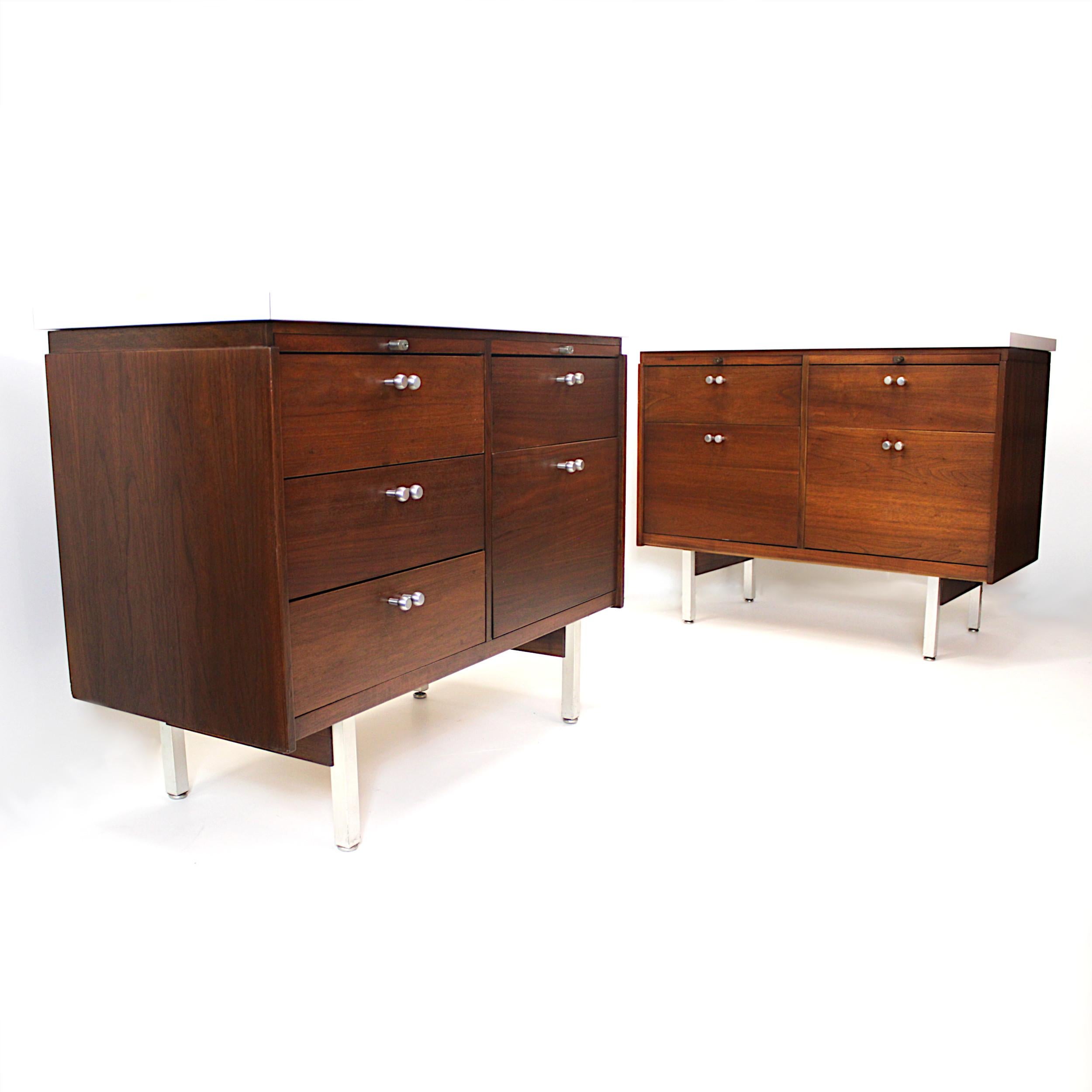 This matching pair of credenzas/consoles are part of the Template Group series of furniture designed by architect/designer Charles Deaton for the Leopold furniture Company. Deaton is best known for designing the iconic 'Sculpture House' located on