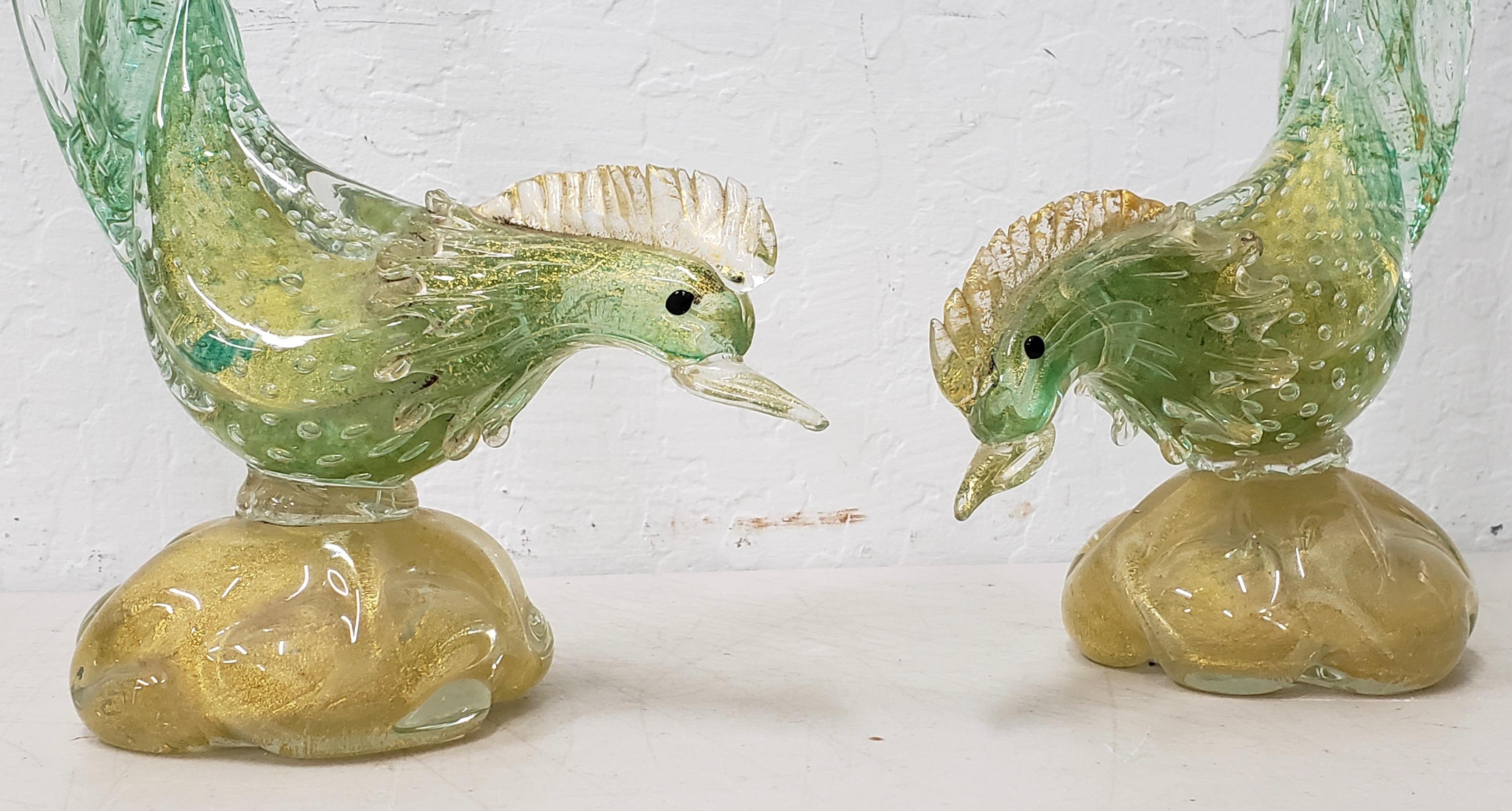 Matching pair of midcentury Murano glass birds, circa 1950s

Fabulous pair of green glass birds with gold fleck highlights.

Each birds measures approximately 7