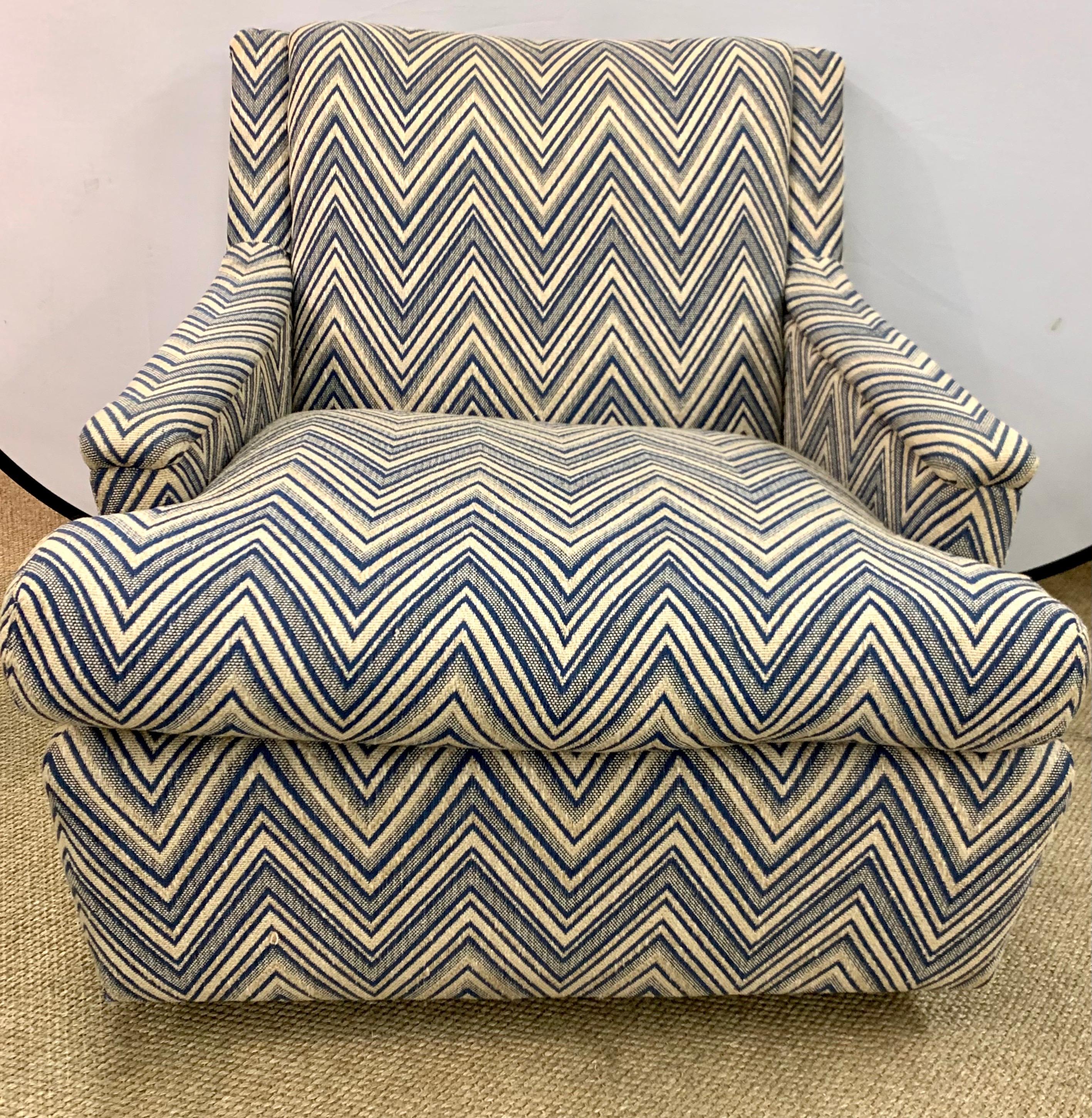 Newly upholstered in a tan and blue chevron fabric is this pair of mid century modern arm chairs. All dimensions are below. One of the most comfortable pair of chairs we've ever sat in. Fully refurbished. Now, more than ever, home is where the heart