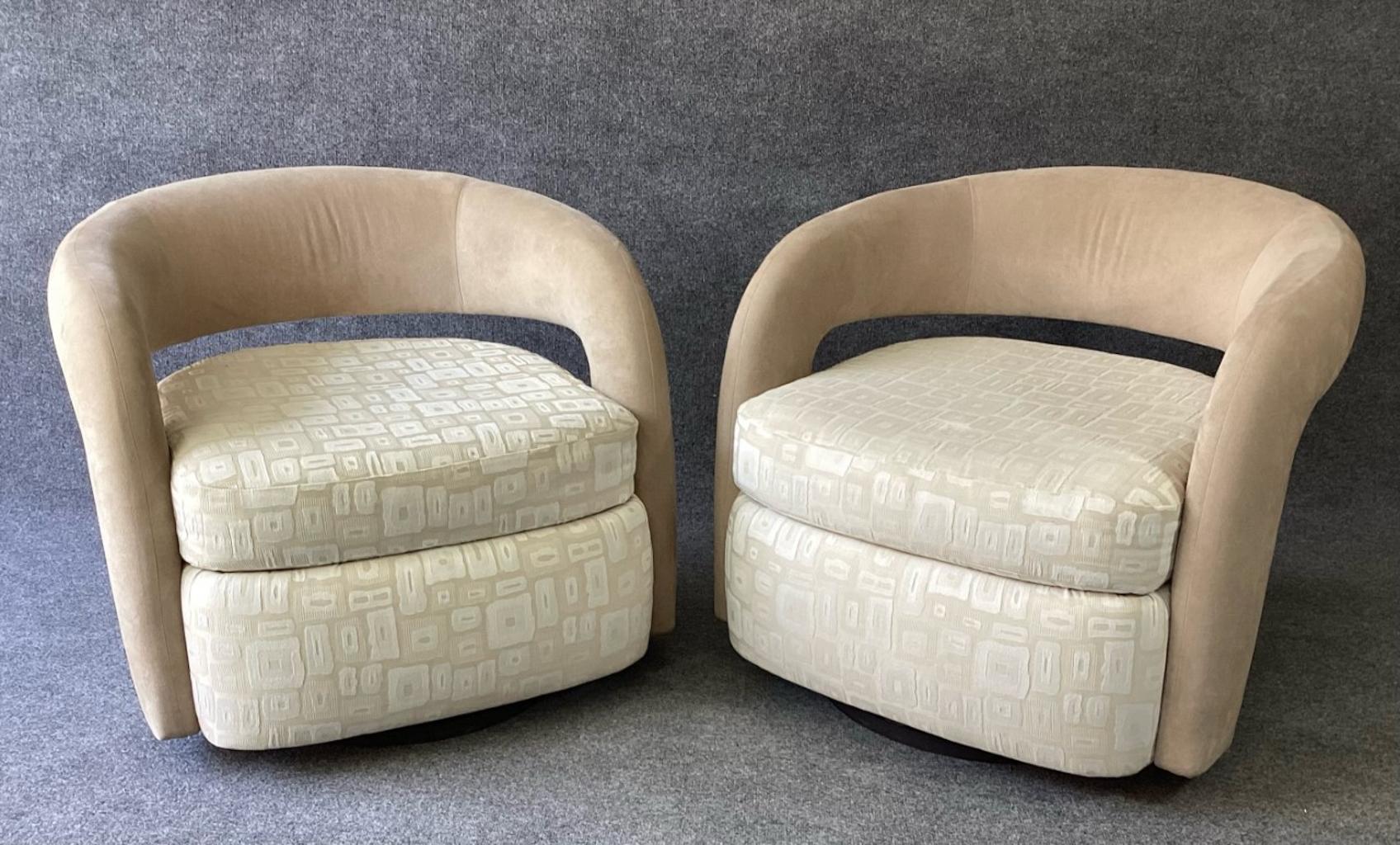 A very nice pair of super comfy and original fabric Targa swivel lounge chairs by Weiman. Both chairs have spring loaded wood bases. So each chair returns to the desired resting position. Notice the loose pillow and floating back/arm. As sleek as