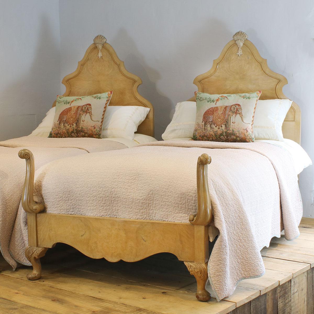 A matching pair of Queen Anne style twin antique beds from the early 20th century with swan neck feet and tall shaped backboards.

These beds accept 3ft wide (36 inches) bases and mattresses.
They can be any length required (75 inches, 78 inches