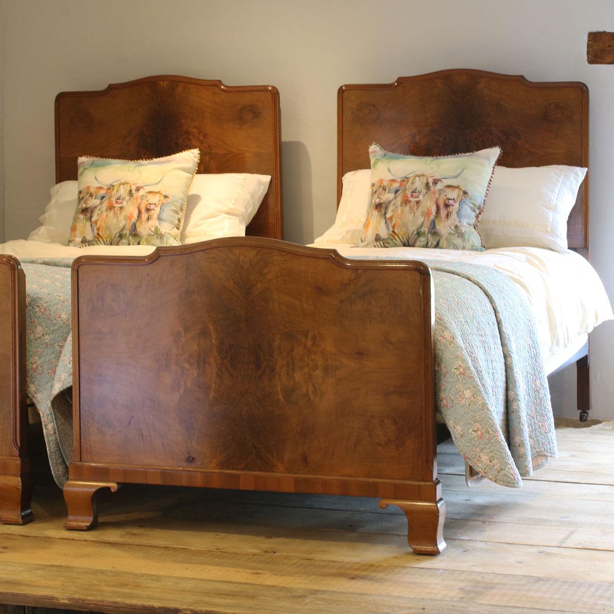 Matching pair of burr walnut early 20th century beds with shaped headboards and footboards.

These beds accept 3ft wide (36 inches) bases and mattresses. 
They can be any length required (75 inches, 78 inches or more) and can stand together to