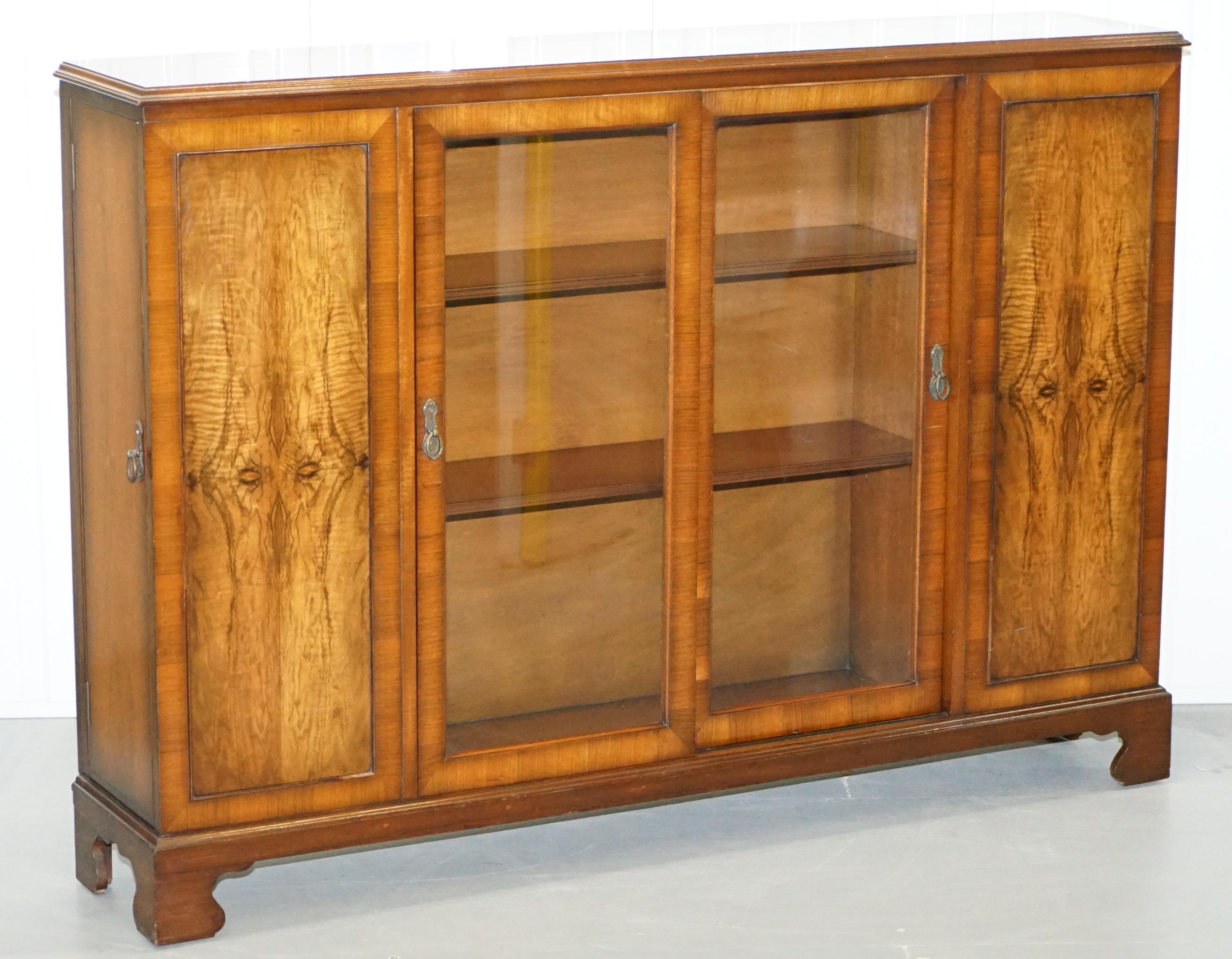 We are delighted to offer for sale this lovely pair of Figured Walnut Berick furniture hand made in England sideboard bookcases with sliding doors and side cupboards

Please note the delivery fee listed is just a guide

There are around 50-100