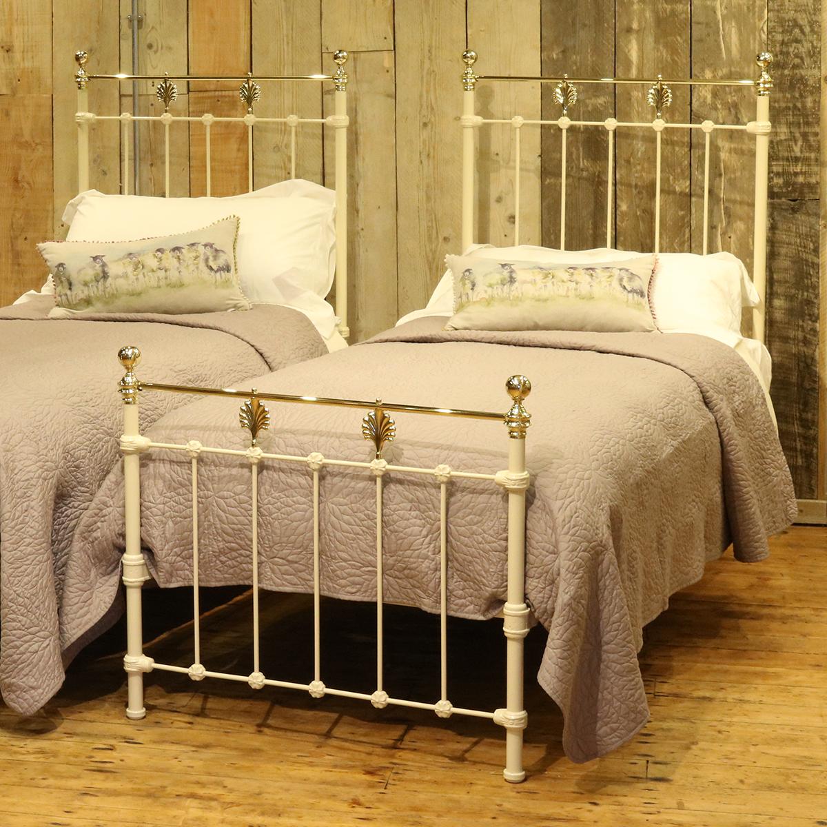 A matching pair of twin brass and iron beds finished in cream with brass leaf decoration.

These beds accept 3ft wide (36 inch or 90 cm) bases and mattresses.
The length can be 75 inches, 78 inches or more if required.
These beds can be joined
