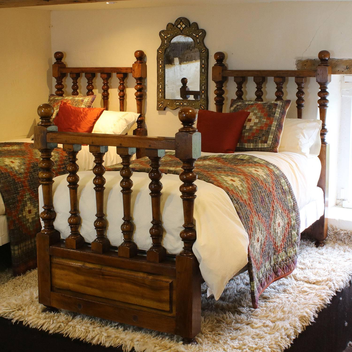 An unusual matching pair of beds with spindle decoration in head and foot boards.

These beds accept 3ft wide bases and mattresses.

The price is for the bed frames alone. The bases, mattresses, bedding and linen are extra and can be provided.