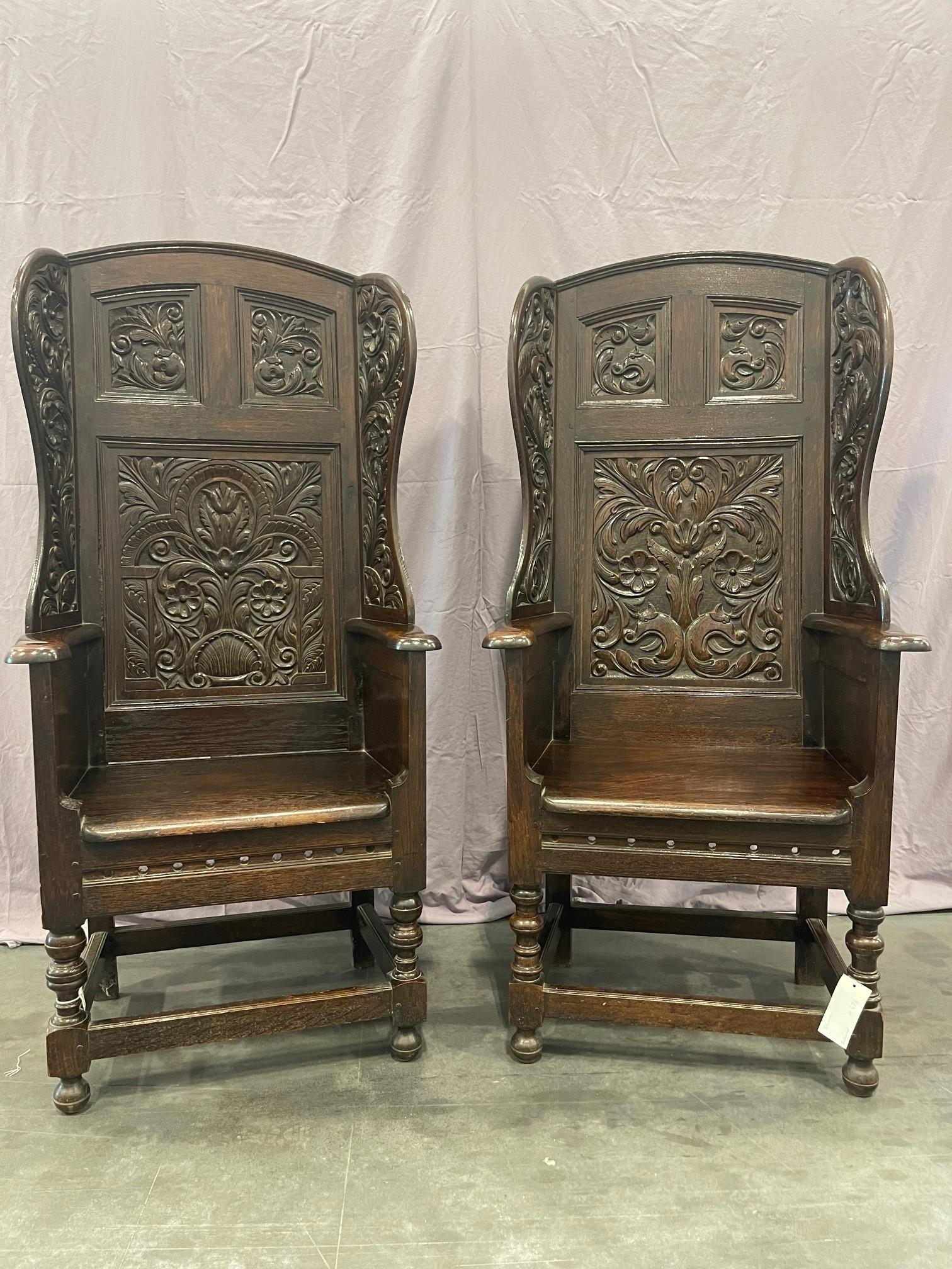 English Matching pair of Victorian Carved Oak Wing Arm Chairs For Sale