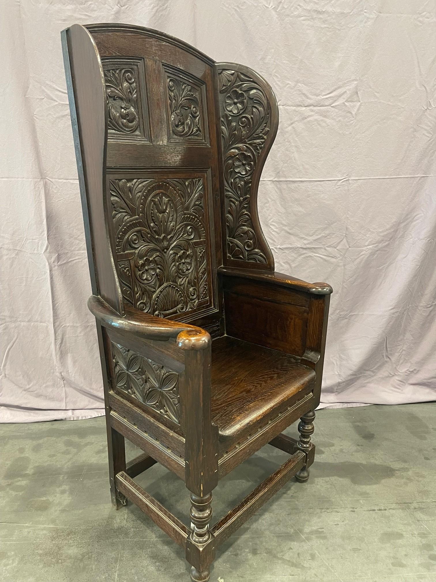 Wood Matching pair of Victorian Carved Oak Wing Arm Chairs For Sale