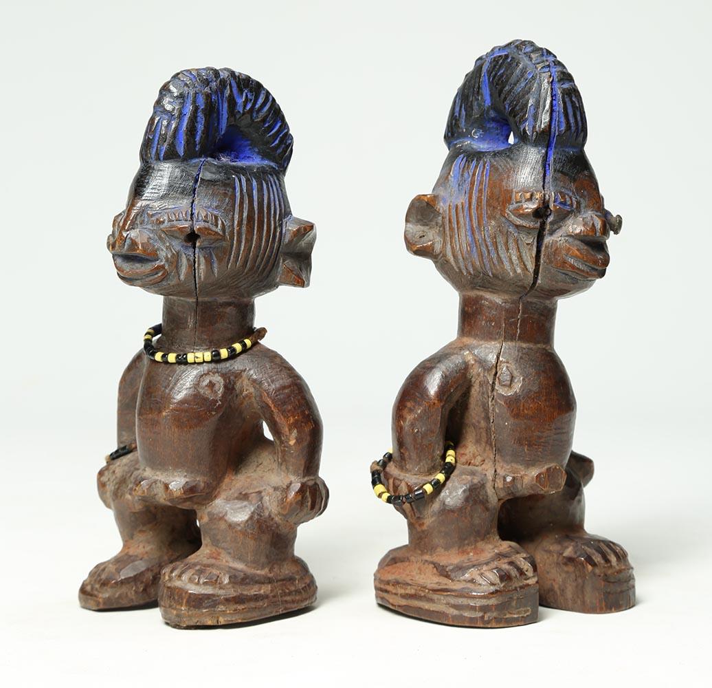 Matching pair of male twin figures 