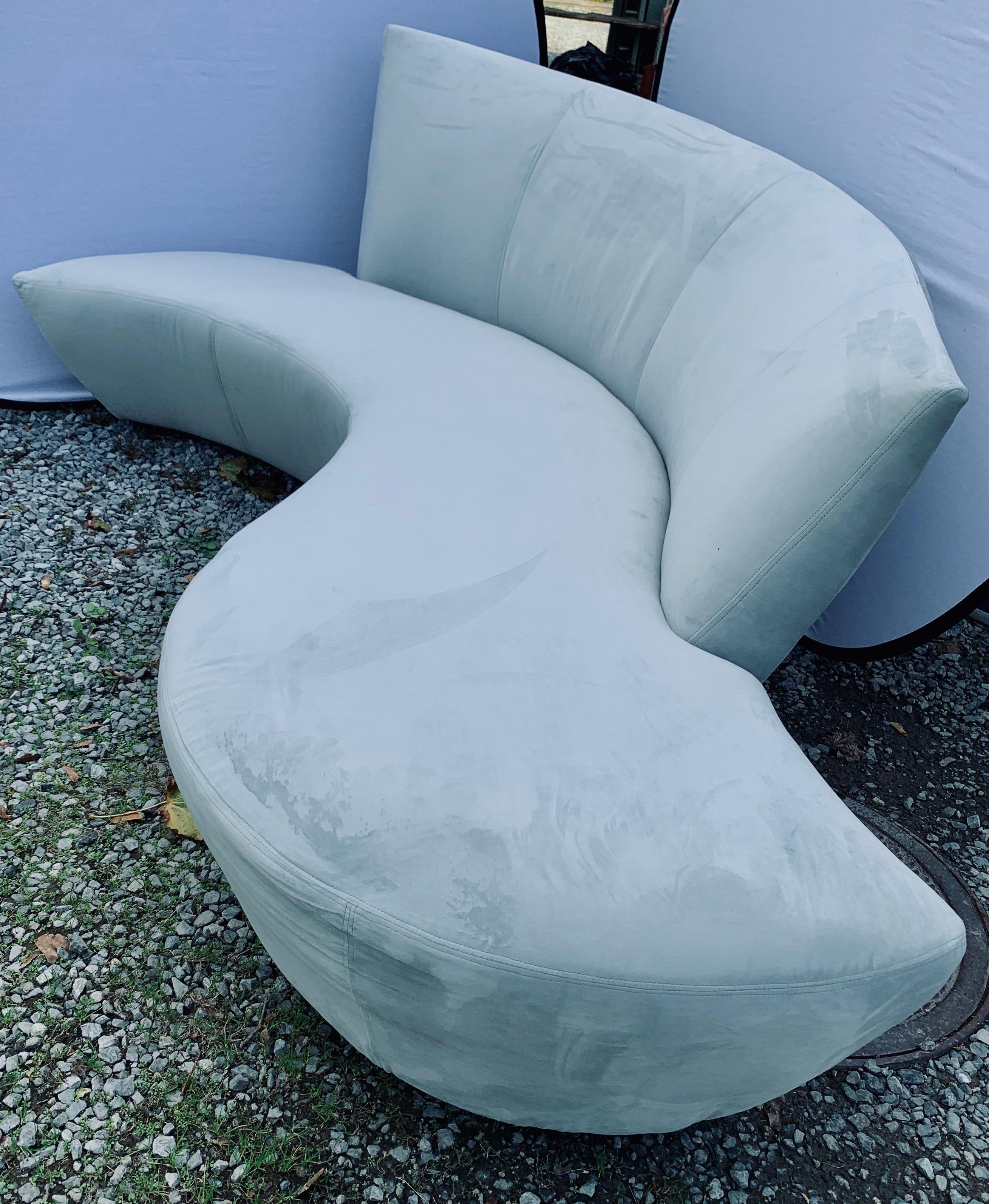 A matching pair of sculptural Mid-Century Modern style sofas designed by Vladimir Kagan and inspired by the curves and undulations of the Guggenheim Museum in Bilbao Spain. They were both newly reupholstered last year and are stunning. Rare to see