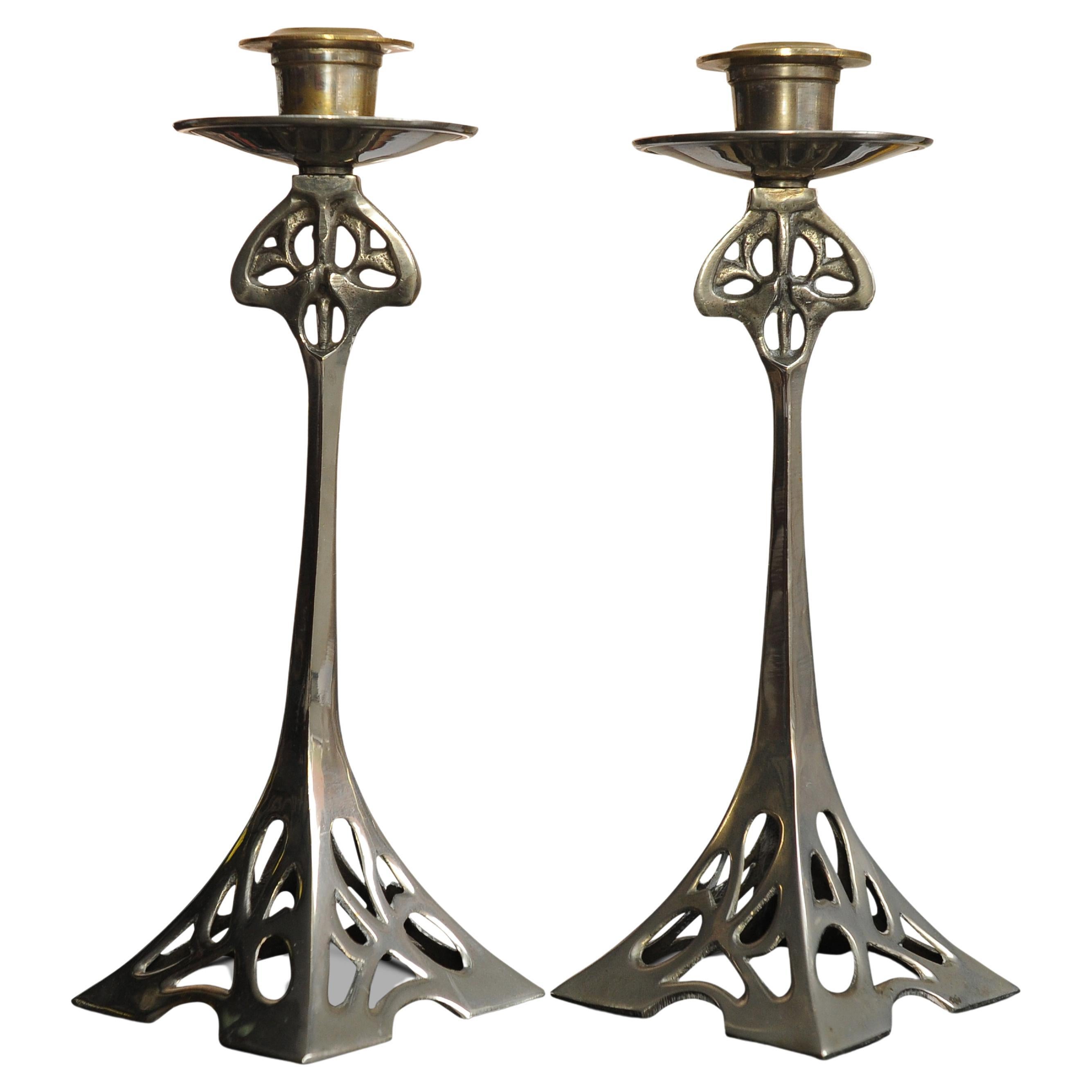 An Elegant Matching Set of Silver Plated Liberty of London Arts & Crafts Candlesticks, 1920's.

These could possibly have been designed by Archibald Knox

The London store Liberty & Co was founded by Arthur Lasenby Liberty (1843-1917) in 1875. The