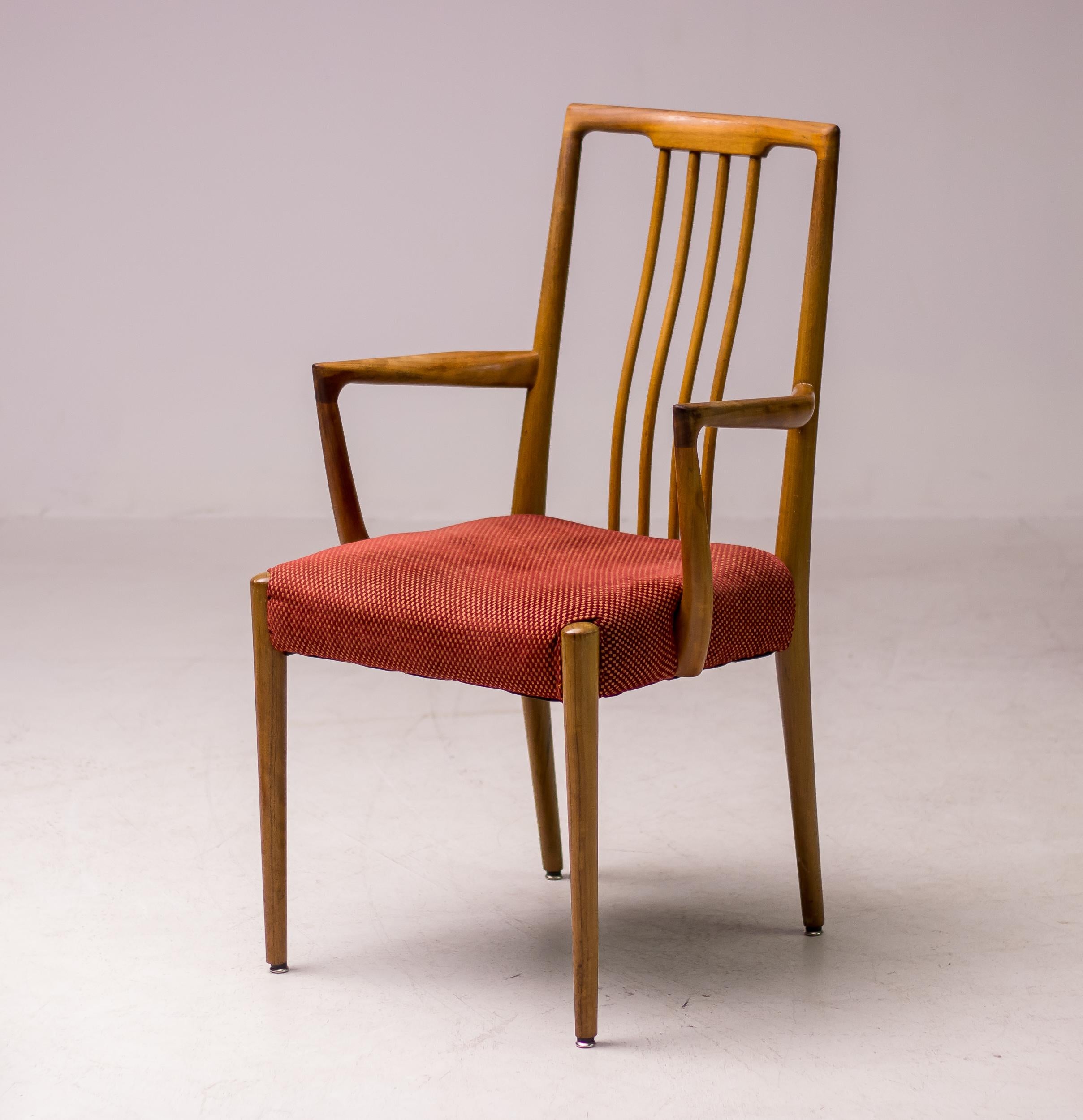 Wonderfully organic carved walnut dining chairs made in Italy circa 1955.
The chairs are unmarked, but are definitely inspired by the designs of Carlo Mollino.
Matching set of 2 armchairs and 4 side chairs, upholstered in a very high-quality red