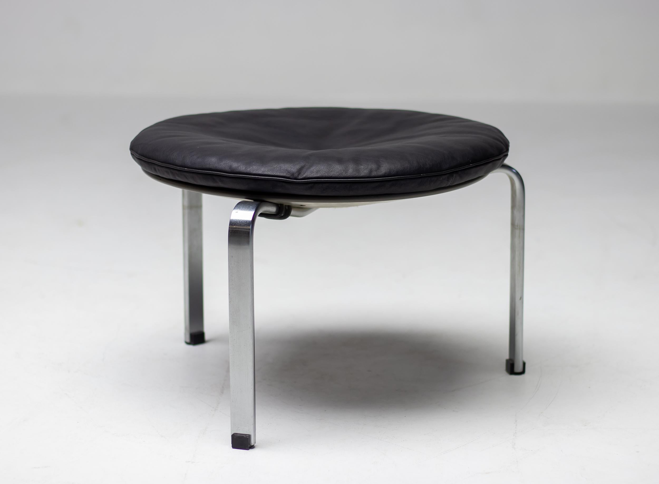 Rare all original early production Poul Kjaerholm E. Kold Christensen set of 3 PK33 stools.
Black leather seat pad and matte-chromed steel base with grey lacquered circular plywood seat support and rubber straps. The pads have the original 1st