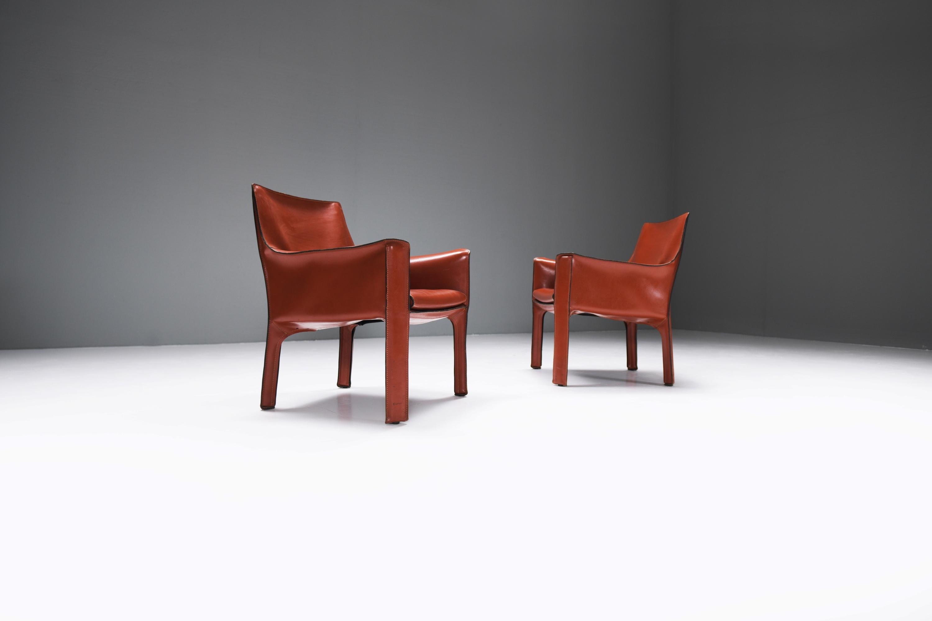 Matching CAB 414 dining chairs in a beautiful burgundy vintage leather. These chairs are no longer produced by Cassina.Designed by Mario Bellini for CASSINA.

These beautiful 414 leather cab chair designed by architect and designer Mario Bellini for