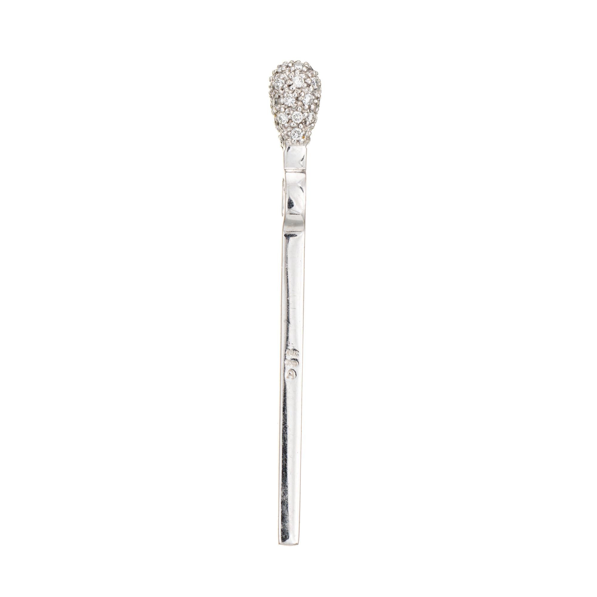 Finely detailed vintage diamond matchstick charm crafted in 18k white gold. 

Pave set diamonds total an estimated 0.25 carats (estimated at H-I color and VS2-SI2 clarity).

The playful charm highlights a diamond set matchstick tip. The piece can be