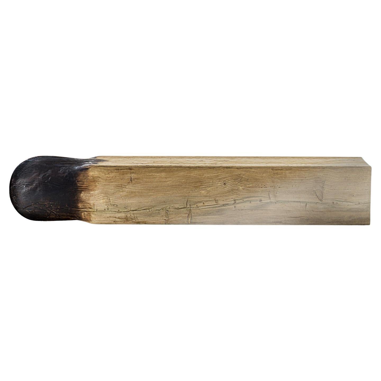 Bench crafted from a single block of solid scented cedar, inspired by the form of a matchstick. One end is enlarged and rounded to echo the head of a match, accentuated by the distinctive ‘vulcano’ finish for a striking visual effect.. The price