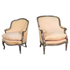 Mated Pair Similarly Upholstered French Carved Walnut Louis Bergere Chairs