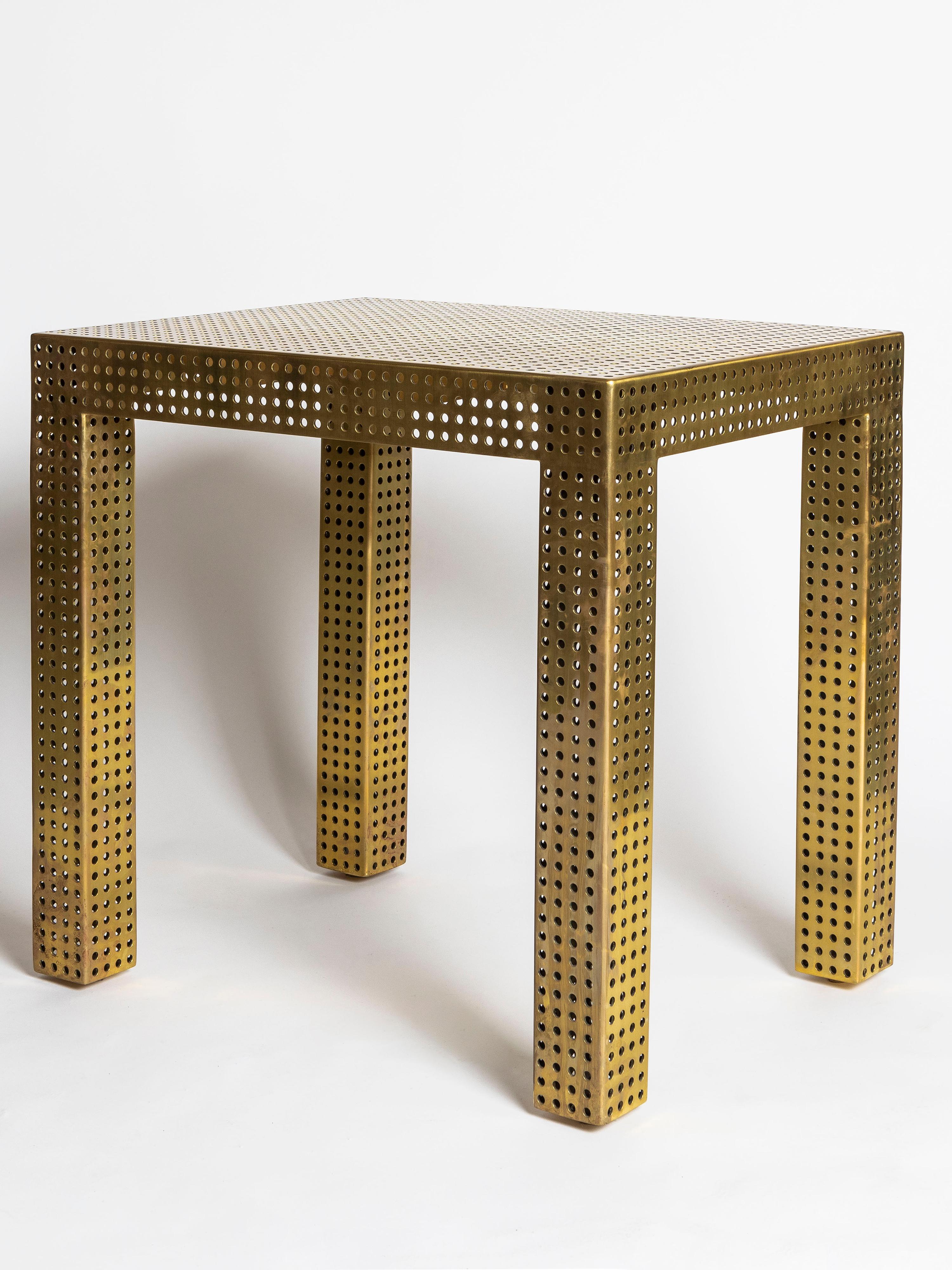 Custom made perforated burnished brass console or side table by Kelly Wearstler. This take on the Classic Parsons table references the style of Mathieu Matégot, appealing to contemporary and Mid-Century Modern fans alike.