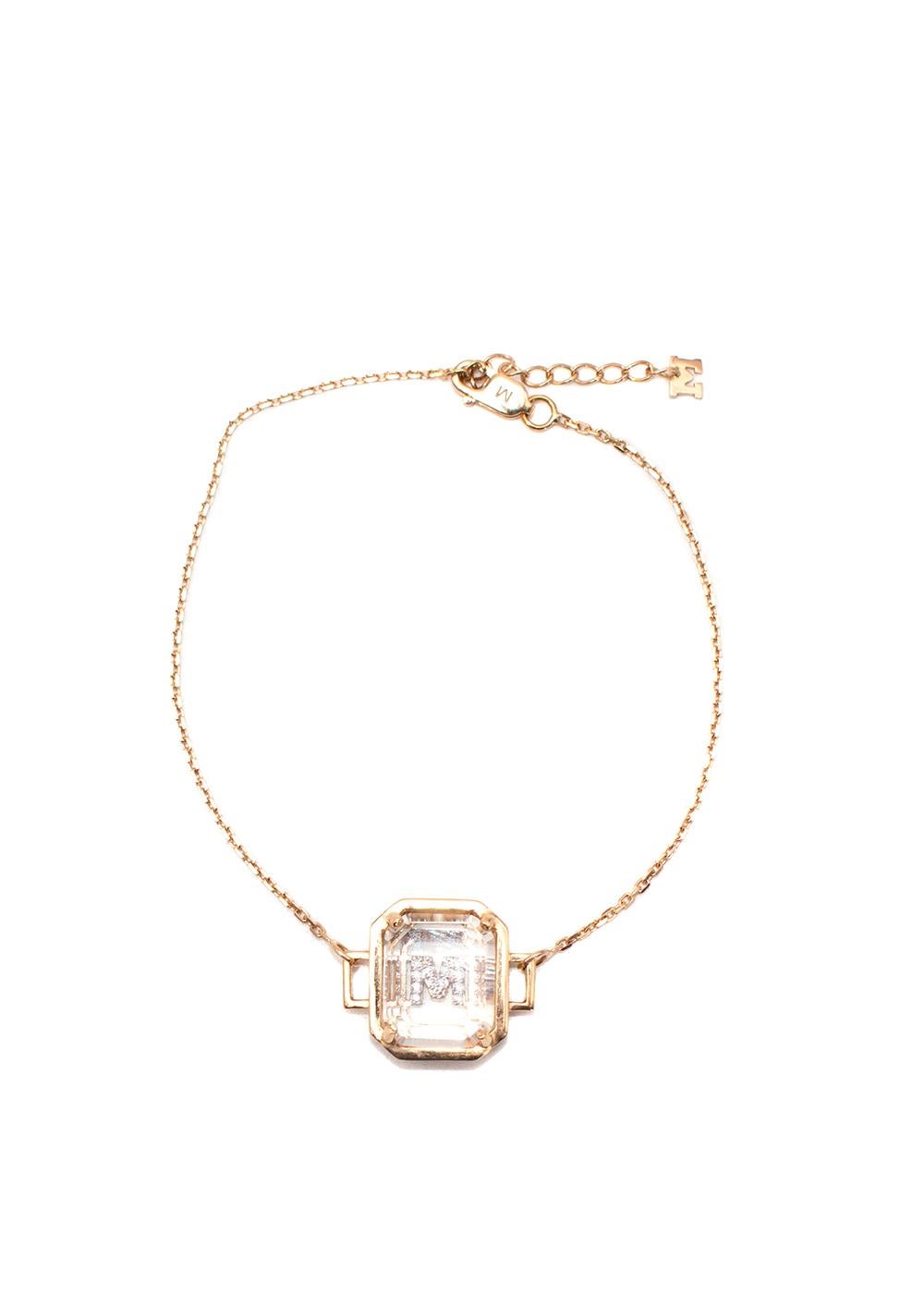 Mateo 14ct gold frame quartz crystal diamond initial pendant bracelet

- 14ct yellow frame and chain 
- Clear quartz body, with white diamond M initial 
-Rolo chain
-Lobster claw fastening

Composition:
Gold
Quartz
Diamond

9.5/10 excellent