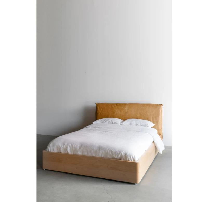 The Mateo Bed, crafted with signature attention to detail, is a stunning centerpiece for any modern bedroom. The bed frame, made with solid maple, has a natural grain that adds warmth and character to the piece. The neutral tones of the honey