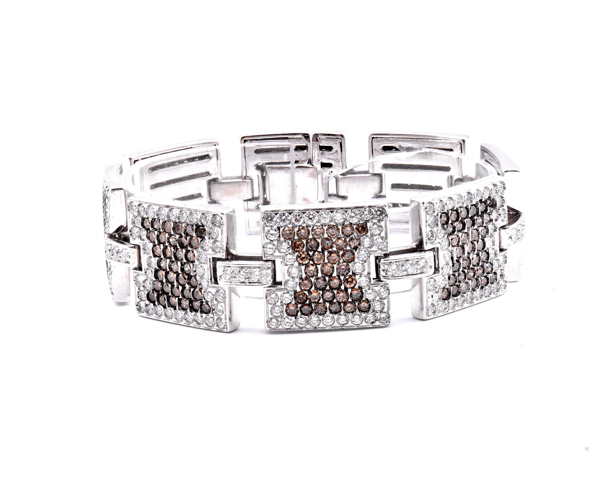 Material: 14K white gold
Diamonds:  274 round cut = 5.48cttw
Color: G
Clarity: VS
Diamonds: 280 round cut = 14.00cttw
Color: Chocolate
Clarity: SI1
Dimensions: bracelet will fit up to a 7.25-inch wrist
Weight: 74.24 grams
