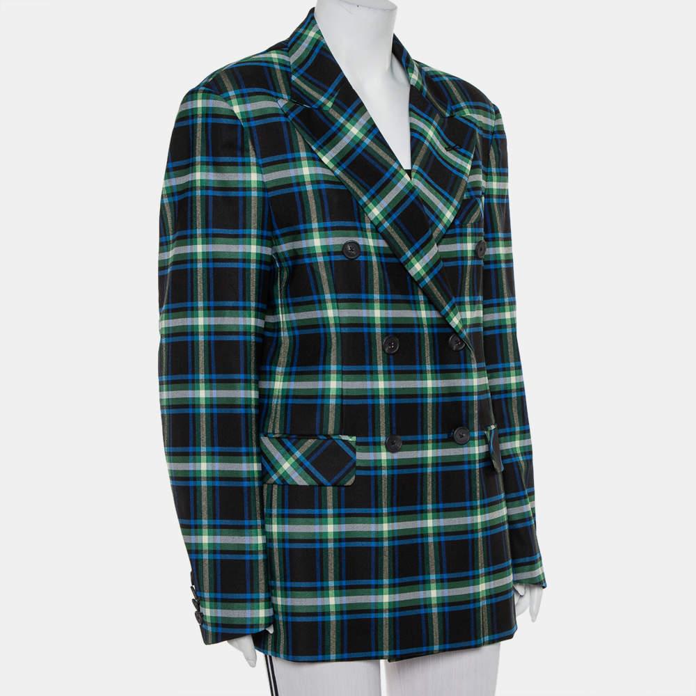Checks are forever in vogue and this double-breasted blazer from Mathew Adams Dolan validates just that! The black creation is tailored to perfection in wool and features peak lapels, a chest pocket, and two flap pockets. It will look great with