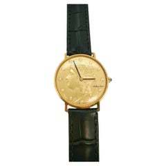Orologio Liberty Coin TISSOT in oro giallo 18 carati