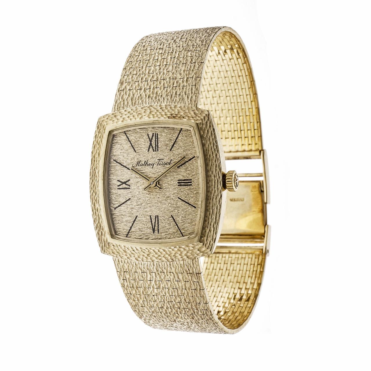 Vintage 1960 -1970 Mathey Tissot solid 14k gold dress watch with a hand textured case, band and dial. 

14k yellow gold
56.1 grams
Band length: 7.25 inches
Length: 28mm
Width: 27mm
Band width at case: 17.6mm
Case thickness: 7.1mm
Band: 585 14k