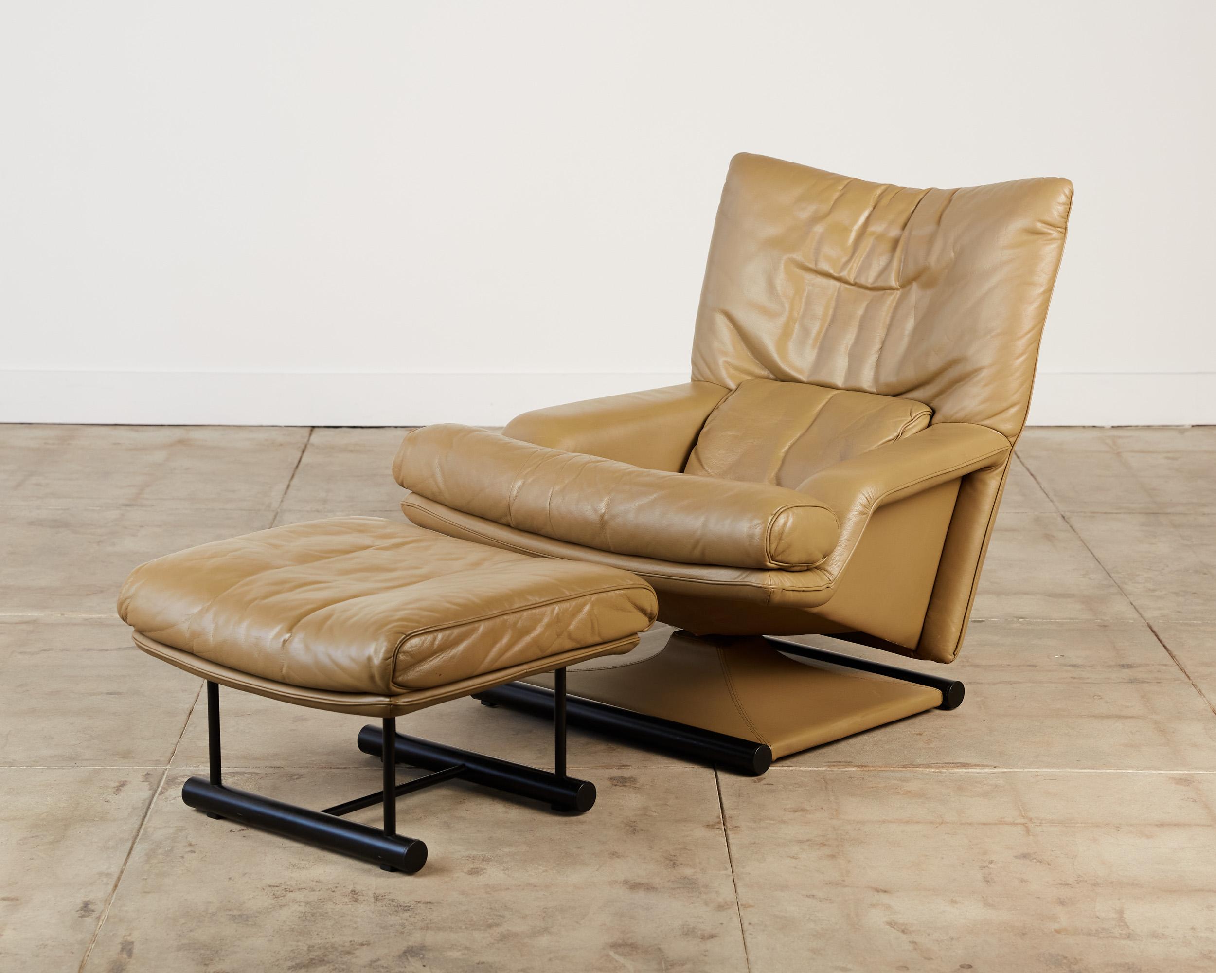 Lounge chair and ottoman designed by Mathias Hoffmann for Rolf Benz, Germany, c.1980s. The set was made for US export to be sold by American retailer Cy Mann. It features a fully upholstered tan leather body and base with two black painted metal