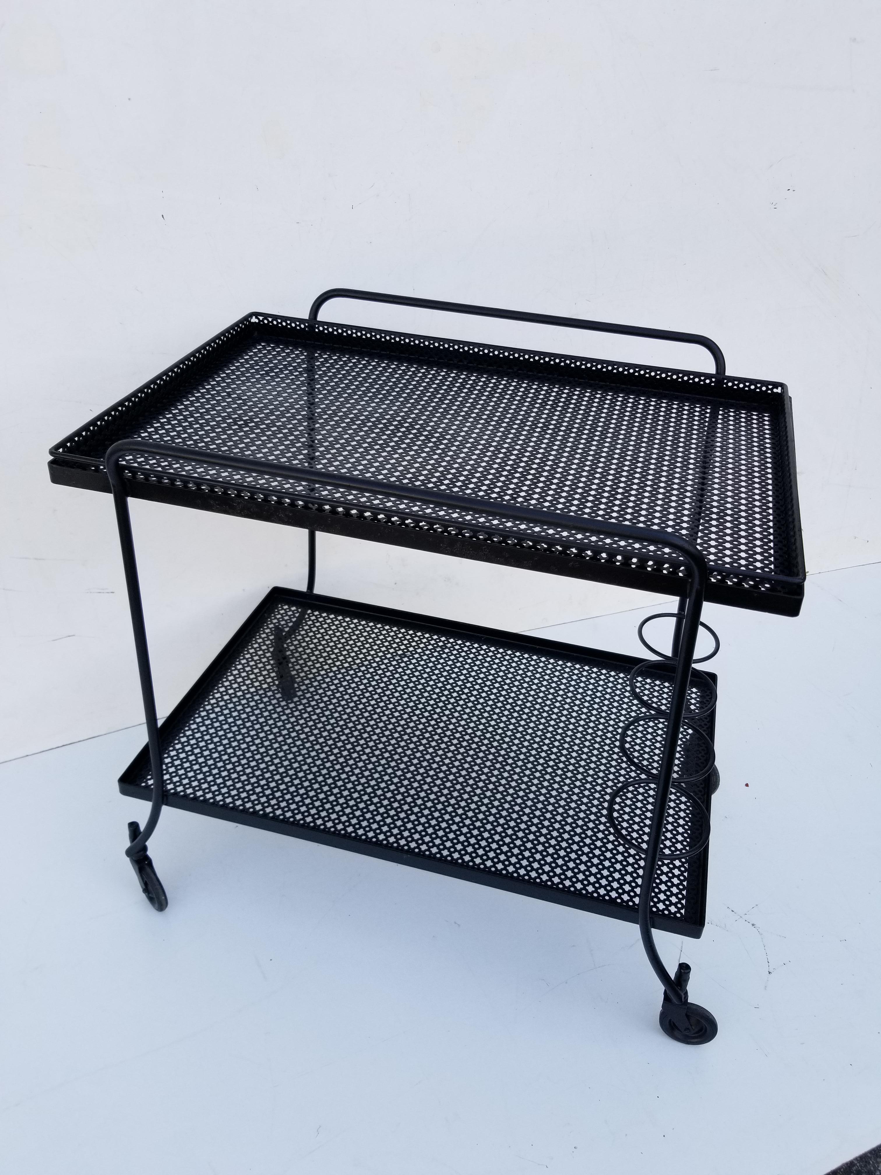Mathieu Matégot metal bar cart, 2-tier .
Good condition, wheels in good working order, can be use.
Removable top tray, dimension on the tray: 28 /18 inches
1-tier high 9 inches
Restored condition.