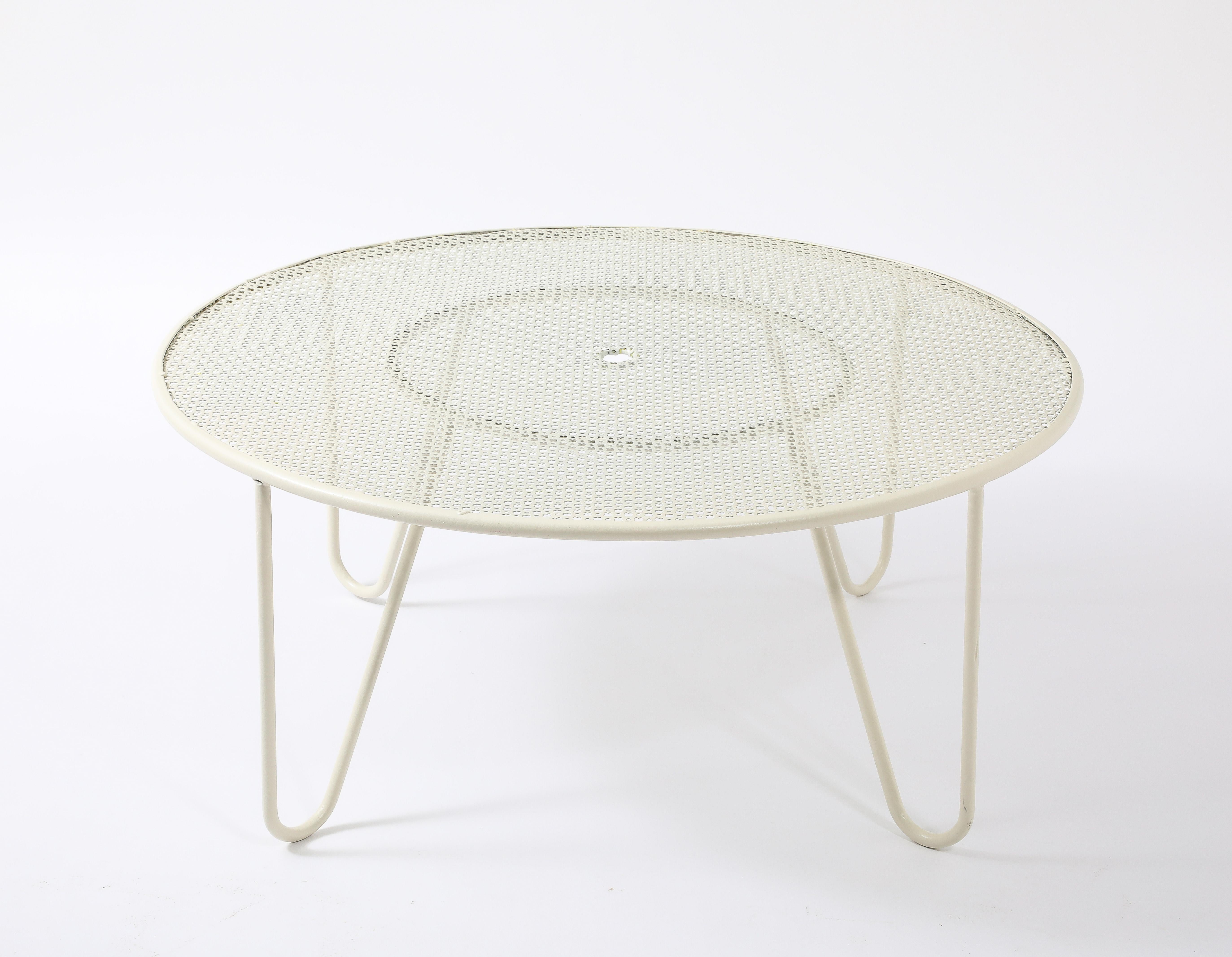 Classic Mategot table with a clover-pierced top.