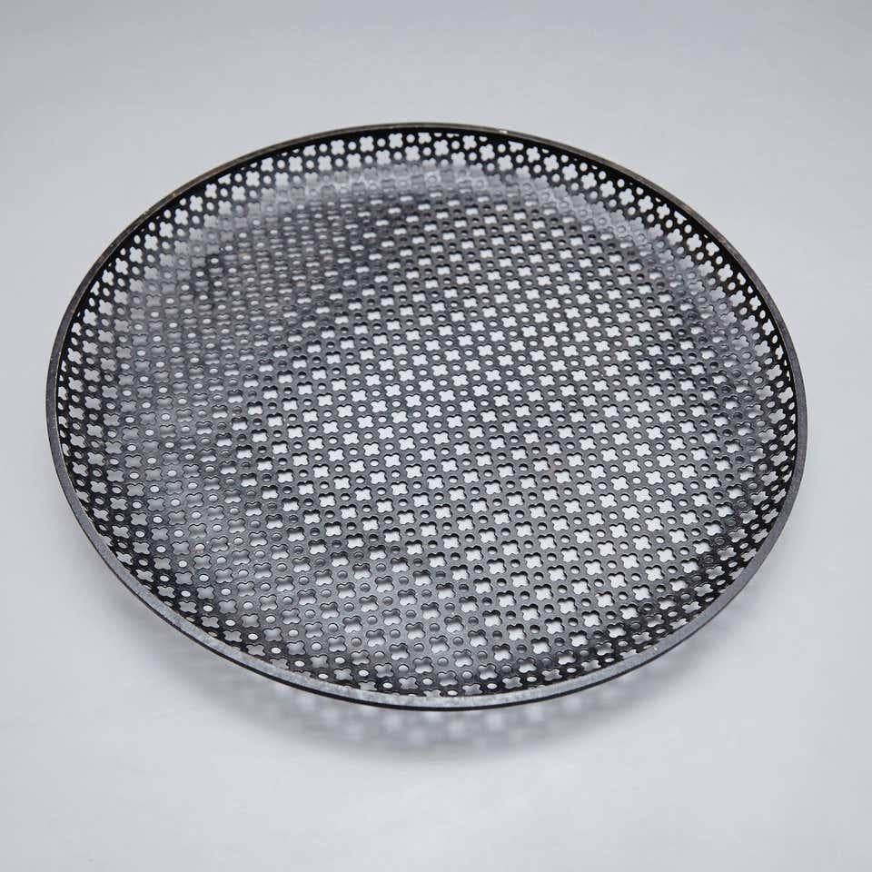Enameled metal plate designed by Mathieu Mate´got.
Manufactured by Ateliers Mate´got, circa 1950.
Lacquered perforated metal with original paint.

In good original condition with minor wear consistent with age and use, preserving a beautiful