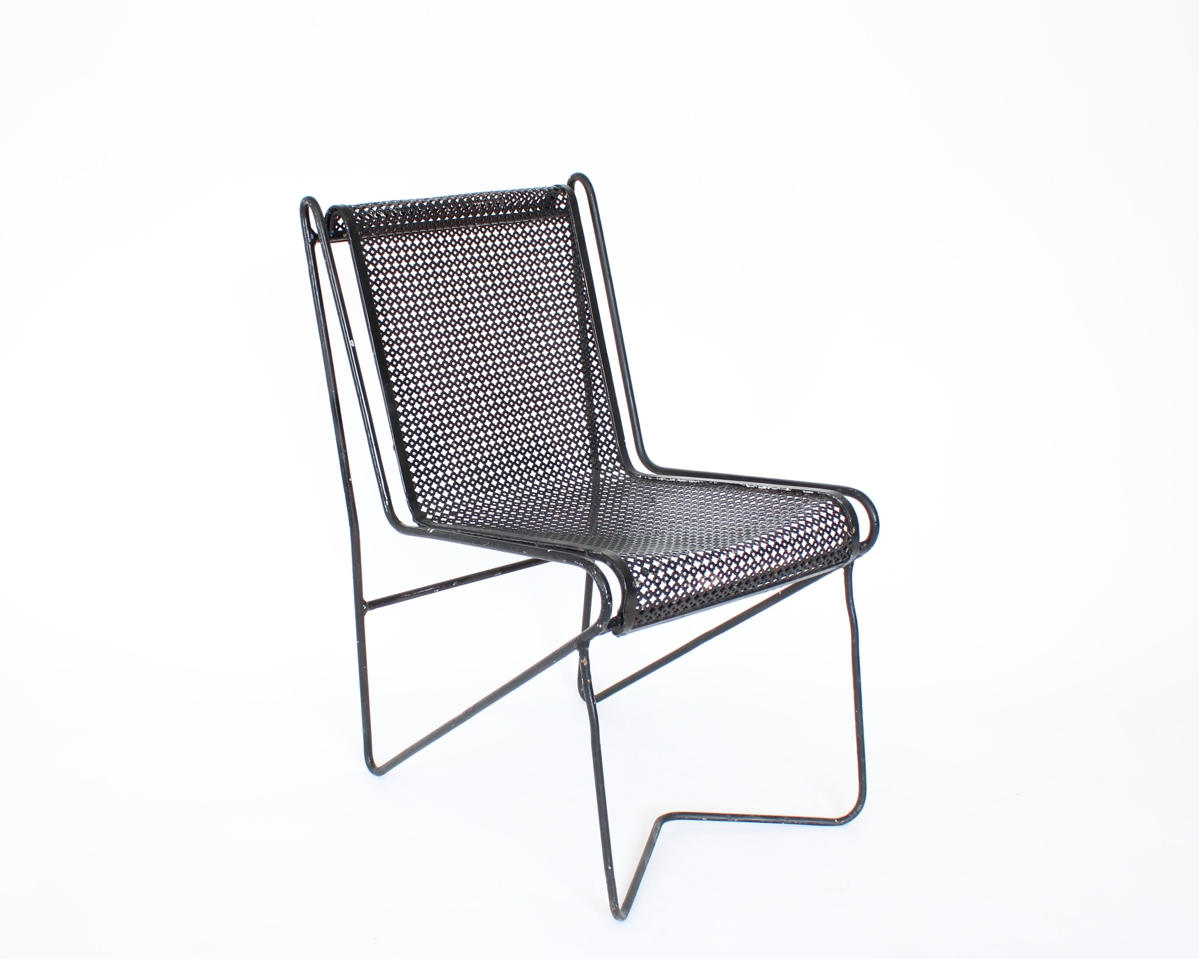 French designer Mathieu Mategot black painted perforated metal side chair. Many of Mategots' designs were intended for outdoor garden use thus painted and often repainted by the owners. 
This chair is similar in style to the period of him working