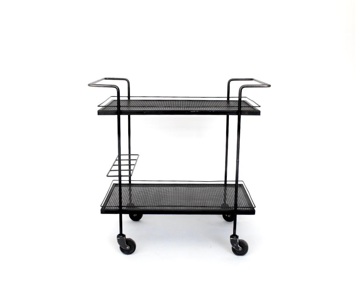 Mathieu Mategot black perforated steel bar cart. Iconic work by Mategot. 
2 levels of trays, Wheels in excellent condition. An area for the bottles to be stored as well. 
No evidence or repainting. Excellent condition. 