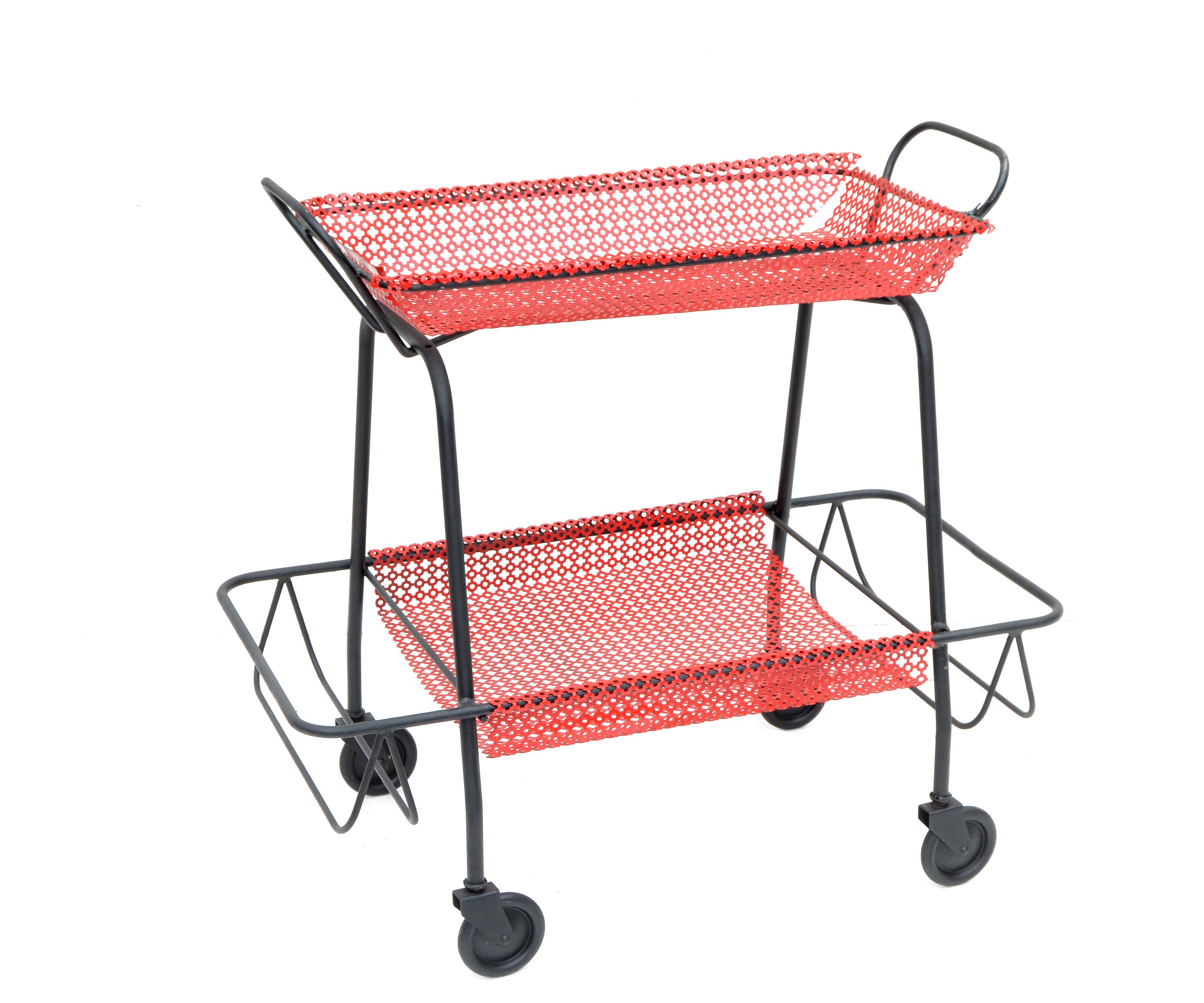 French Mathieu Matégot bar cart in red & black finish, features hand made mesh baskets and comes with the original rubber wheels.
All working smoothly and ready for a new Home.
 