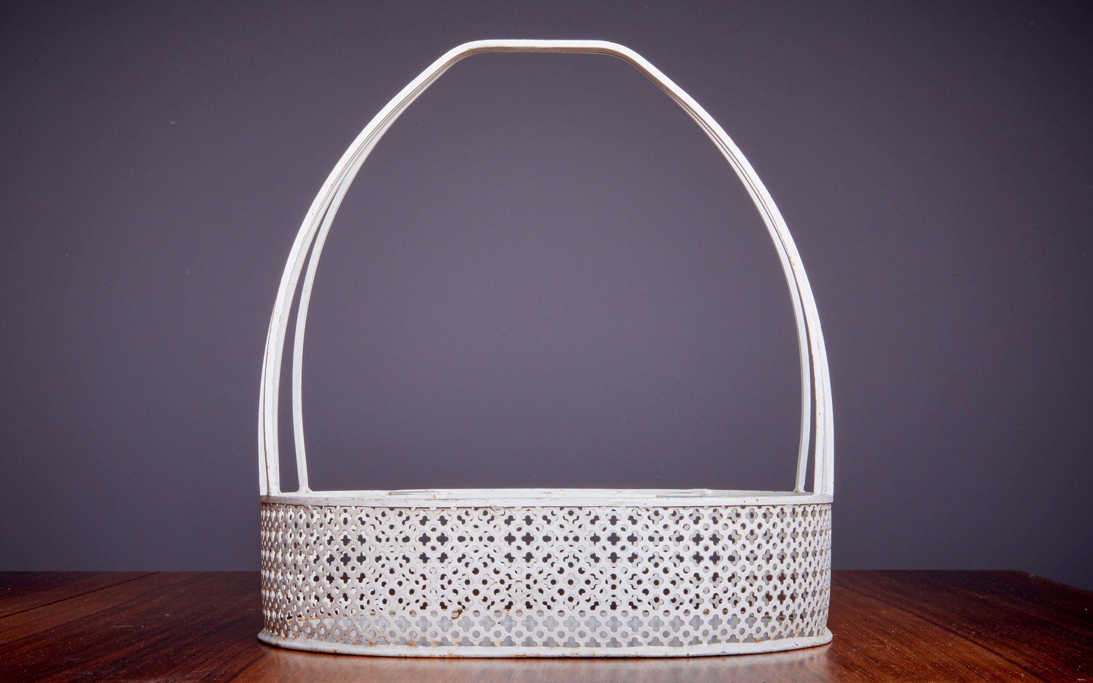 Classic and published Matégot bottle holder in white metal. Original vintage condition.

Mathieu Matégot (1910-2001) was a Hungarian-born French designer and artist. He is known for his innovative use of metal tubing and perforated metal sheets,
