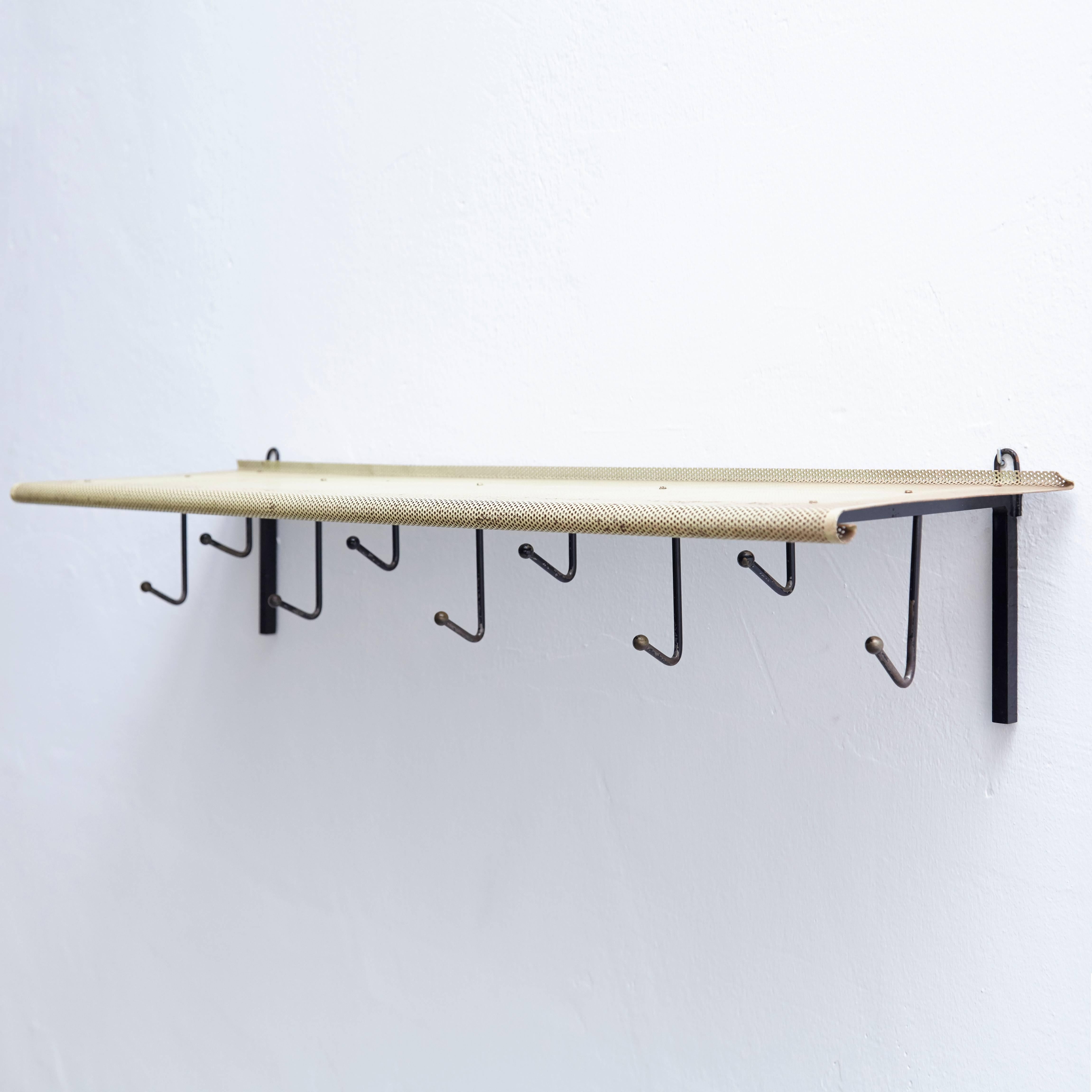 Coat rack designed by Mathieu Matégot.
Manufactured by Artimeta (Netherland), circa 1940.
Perforated, lacquered metal.

In good original condition, with minor wear consistent with age and use, preserving a beautiful patina.

Mathieu Matégot