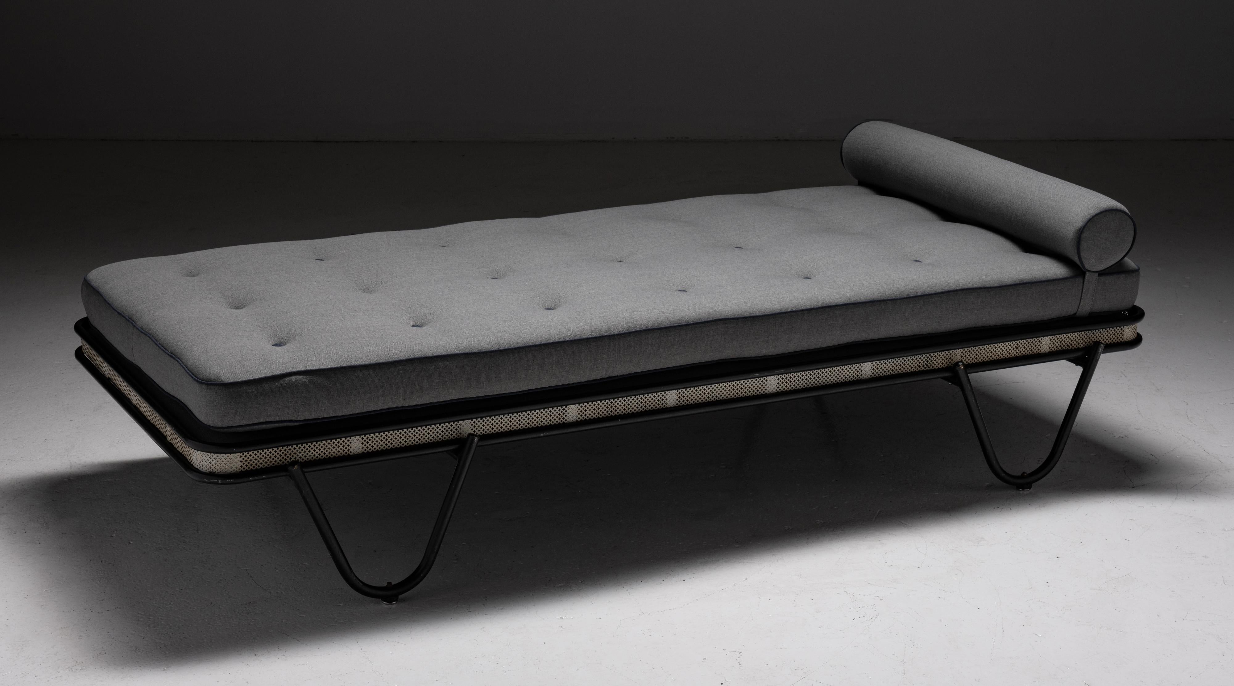 Mathieu Matégot Daybed, France 1950.

Newly reupholstered in Mahaham worsted wool charcoal grey with black trim. Pierced metal frame painted black and white.

Measures: 77