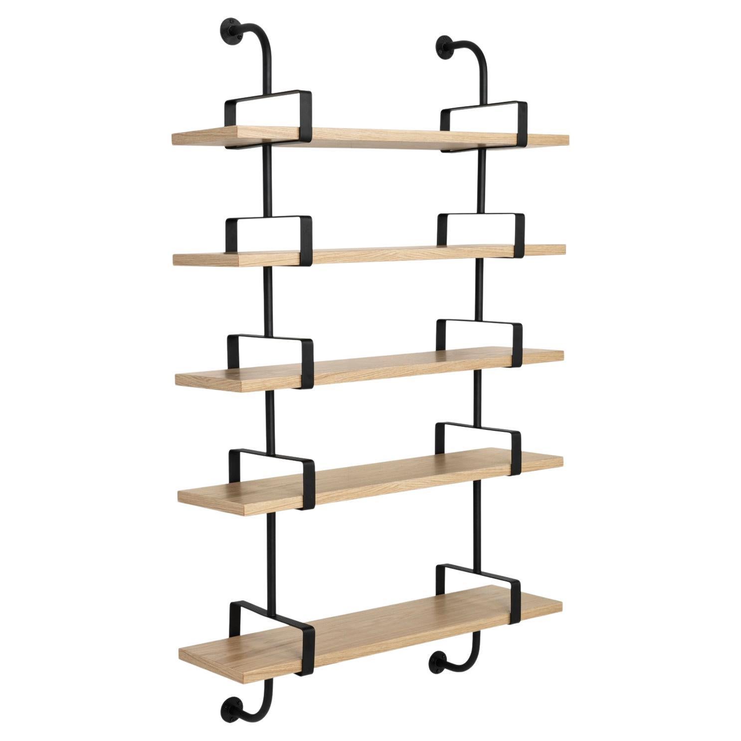 Mathieu Matégot 'Démon' 5-Shelf System for GUBI in Oak.

The Démon Shelf, or the Biblio-Démon in Matégot’s original 1954 sketches, was part of a “plan d’execution de la bibliothèque,