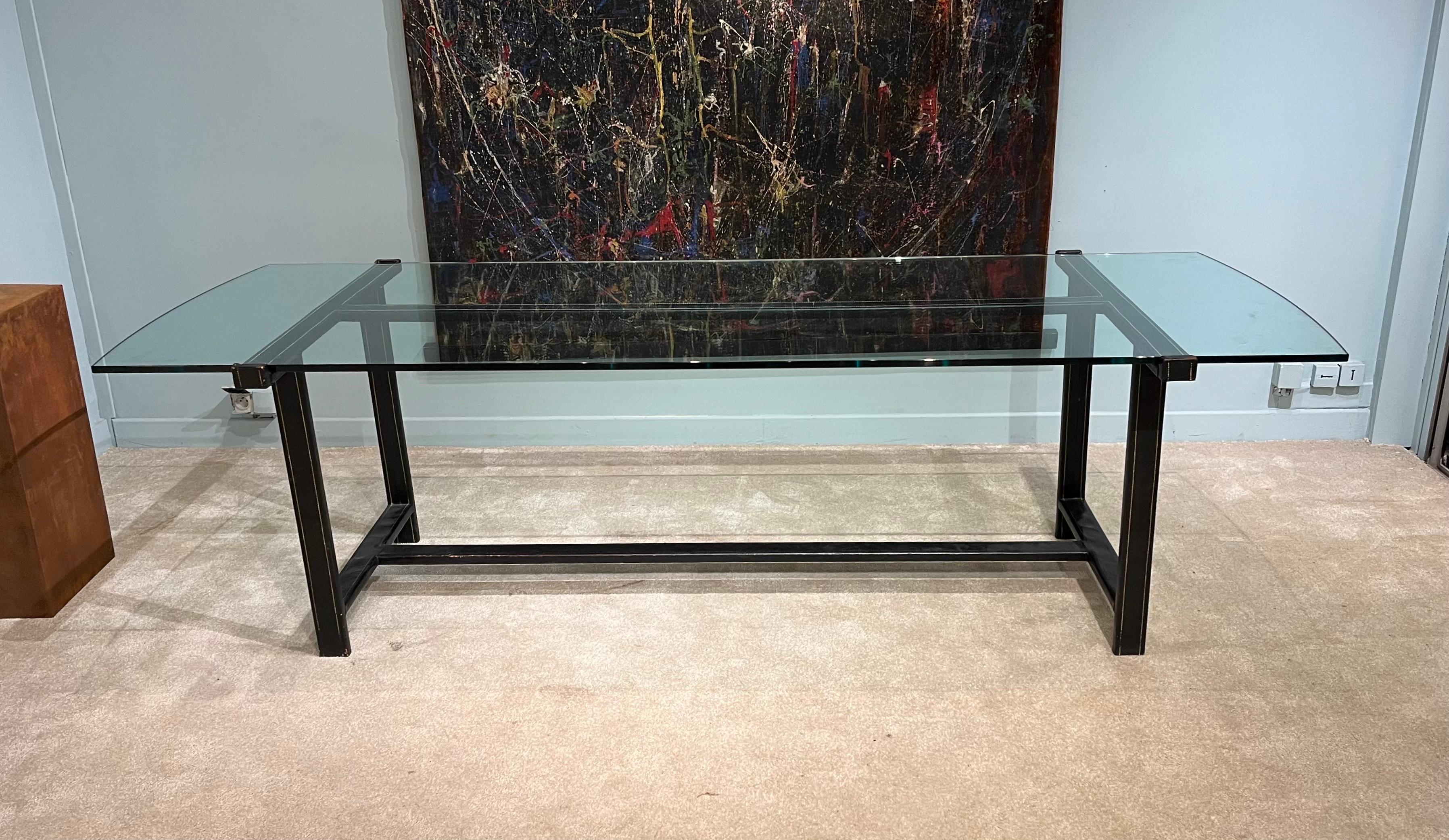 Dining table in metal sheathed in black leather stitched sellier and glass top, 1958.

This unique piece (1958) was commissioned for the apartment of a Parisian doctor, friend of Mathieu Matégot.
Private collection Paris.

Bibliography : Mathieu